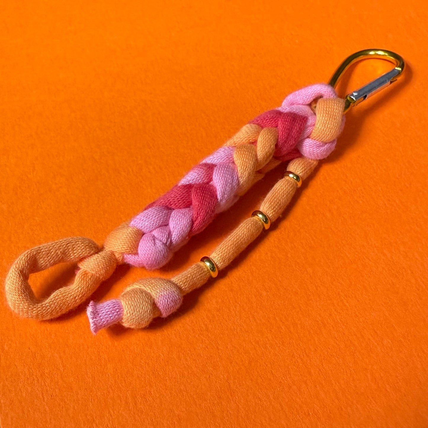 Braided jersey charm