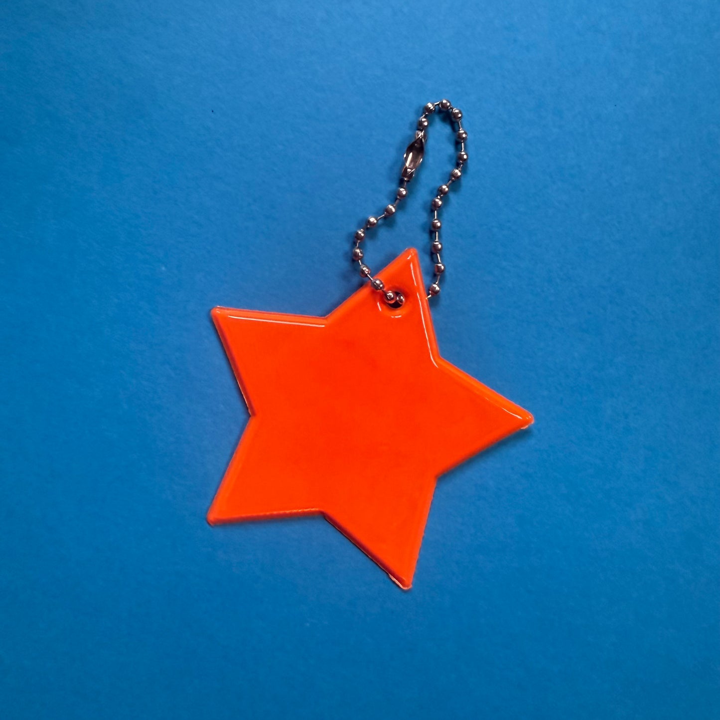 Neon star light reflector charm