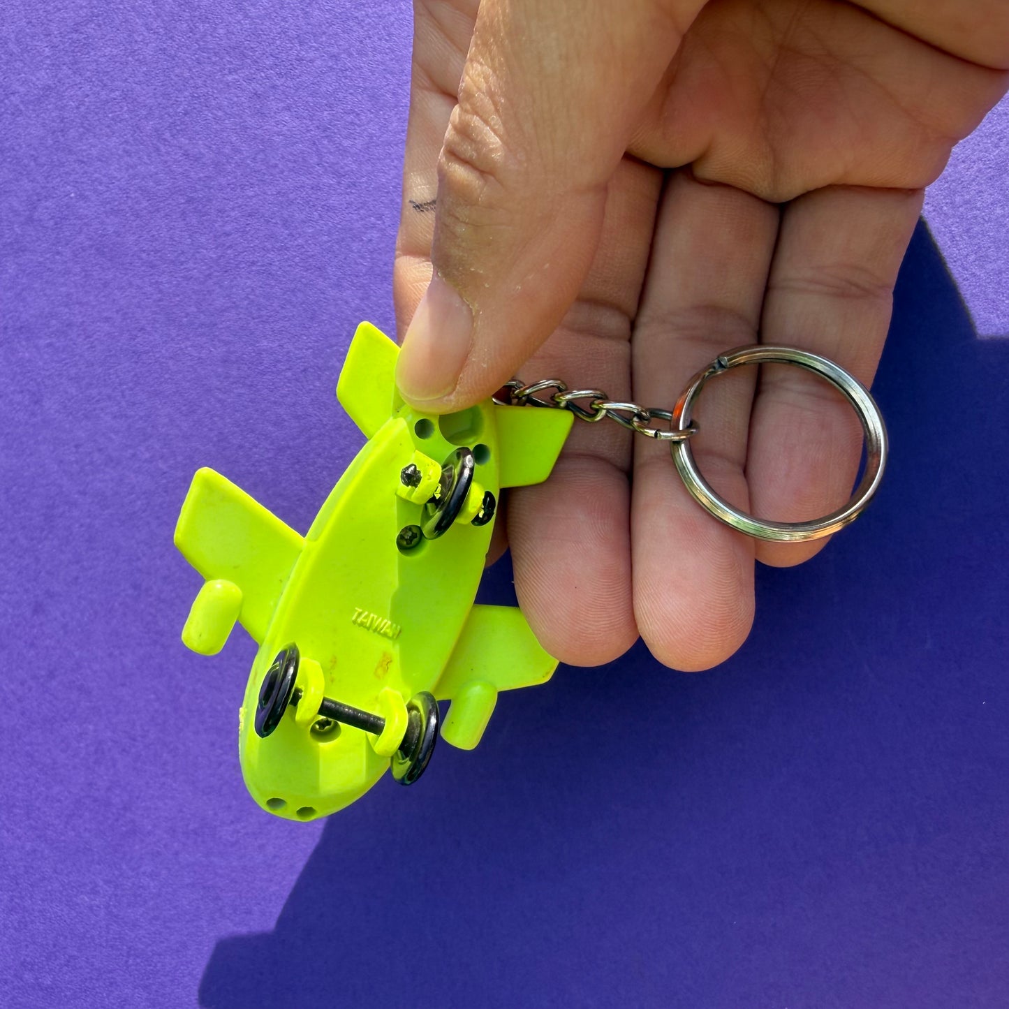 Neon retro 80s keyring plane