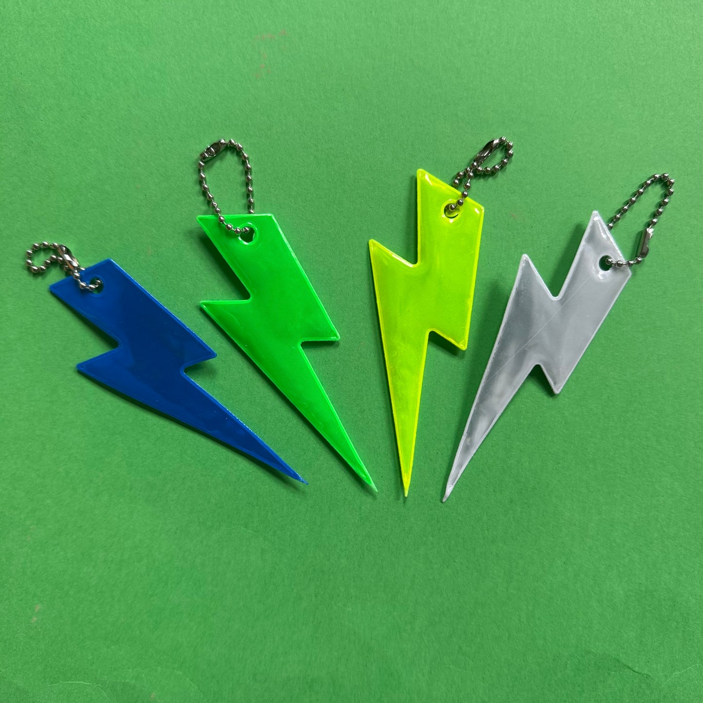 Neon bolt light reflector charm