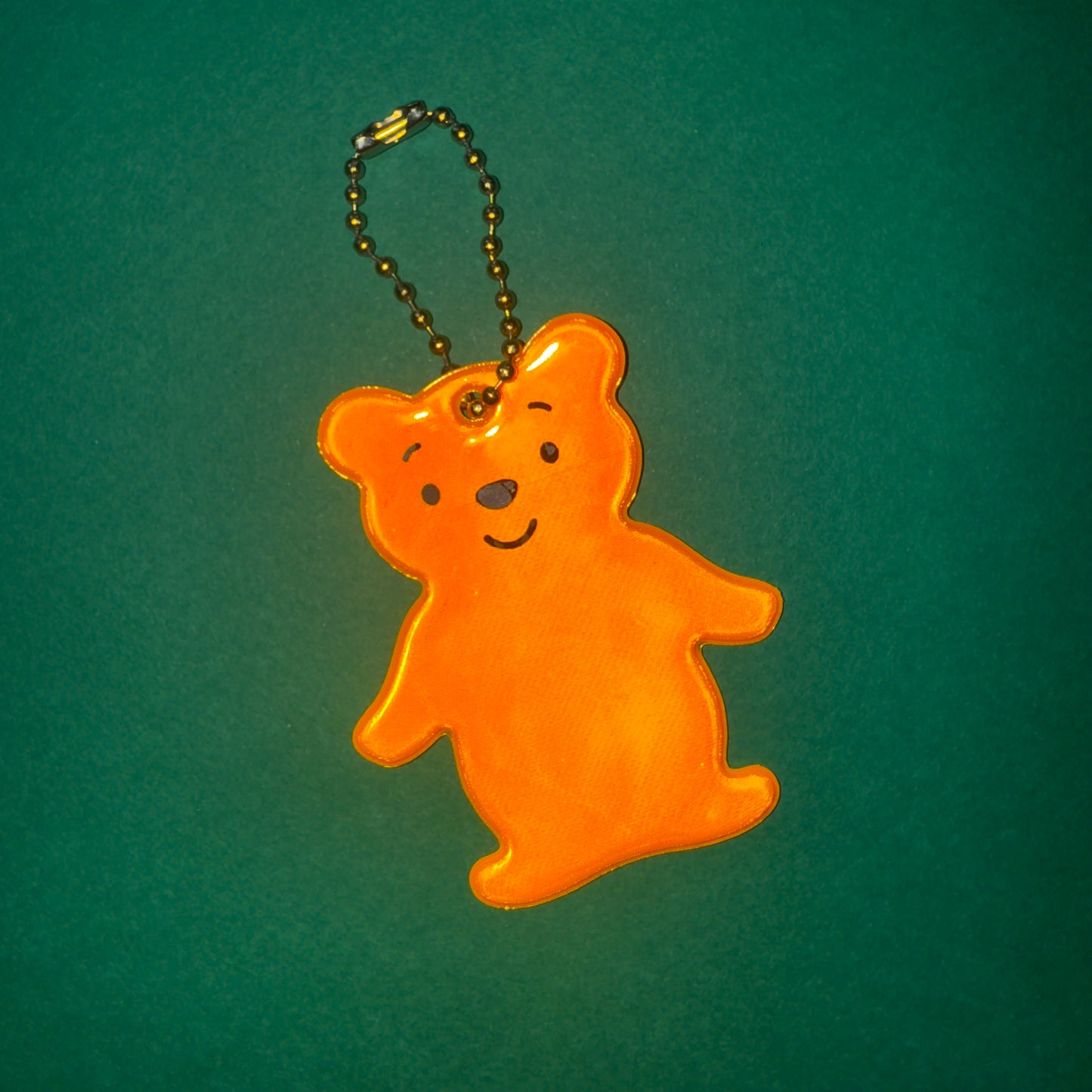 Neon orange teddy bear light reflector charm