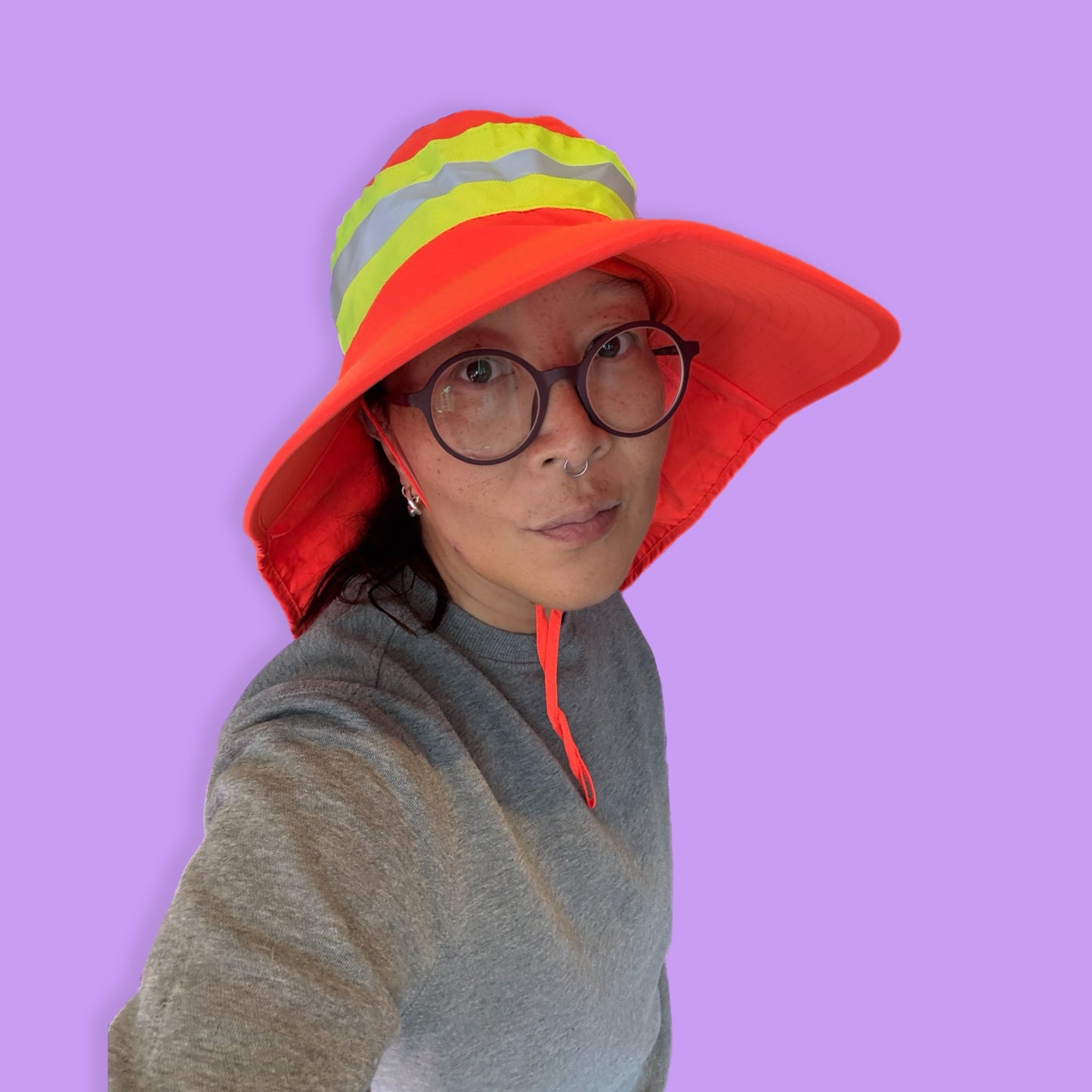 Neon orange rain and sun hat