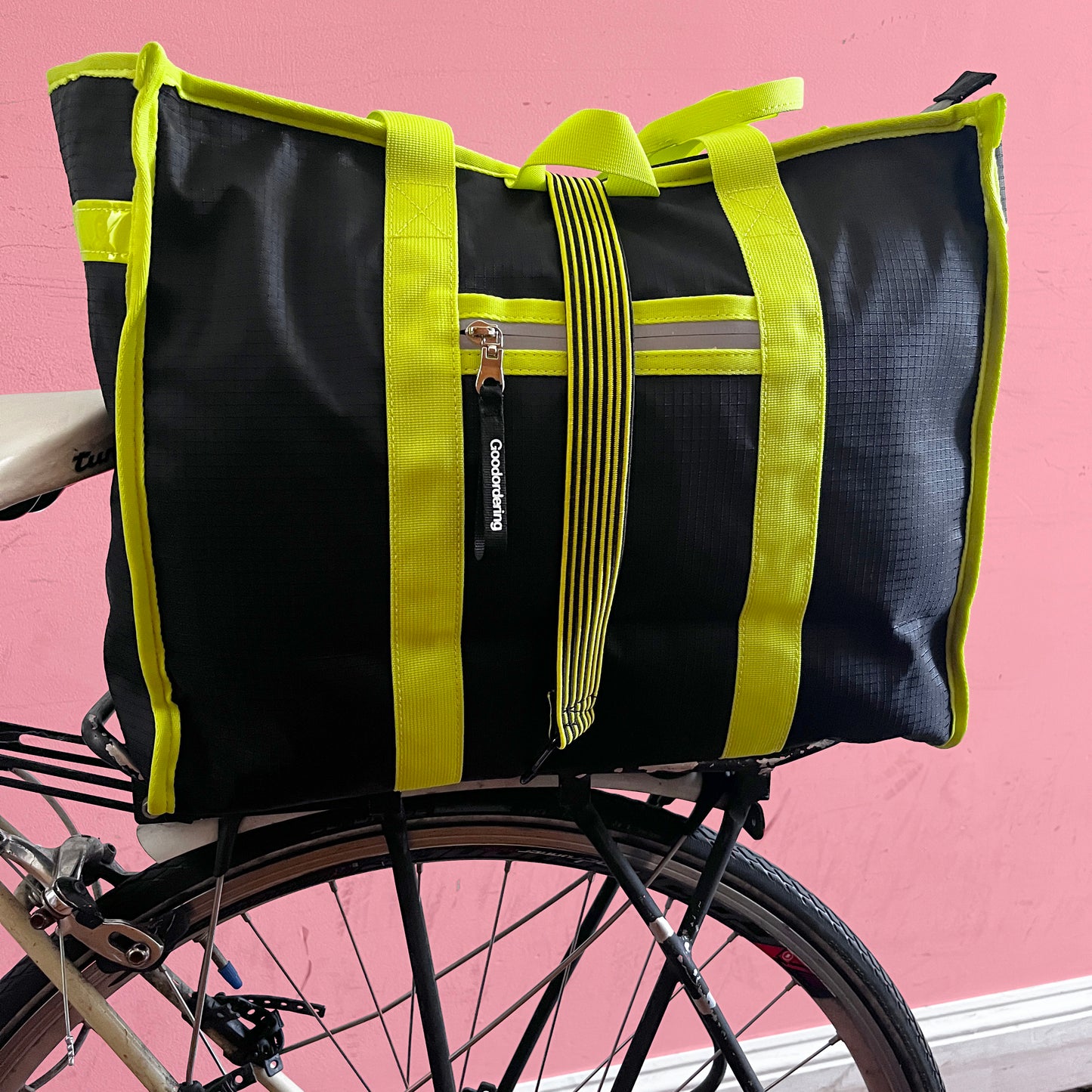 tote backpack straps neon yellow and black on bicycle