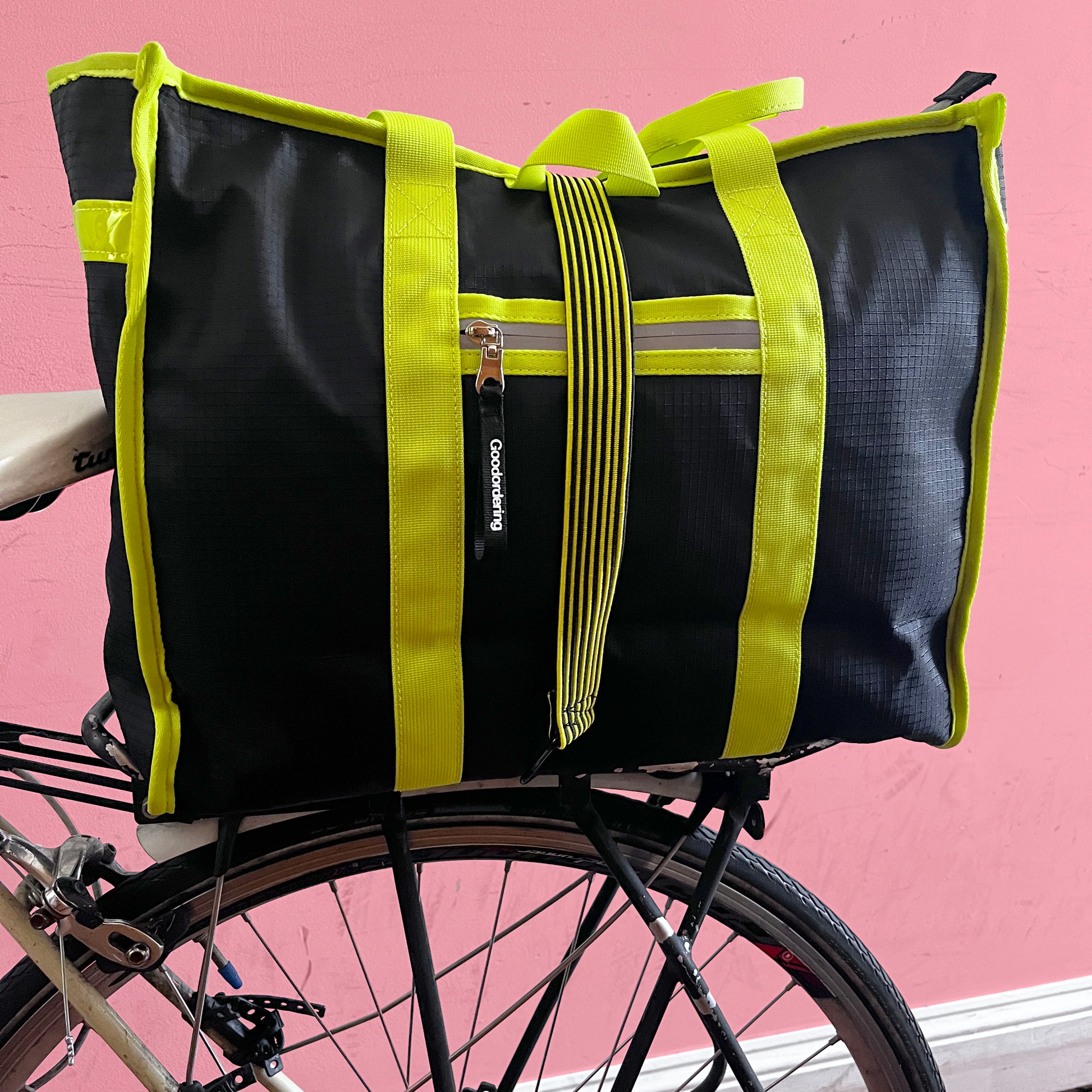 tote backpack straps neon yellow and black on bicycle