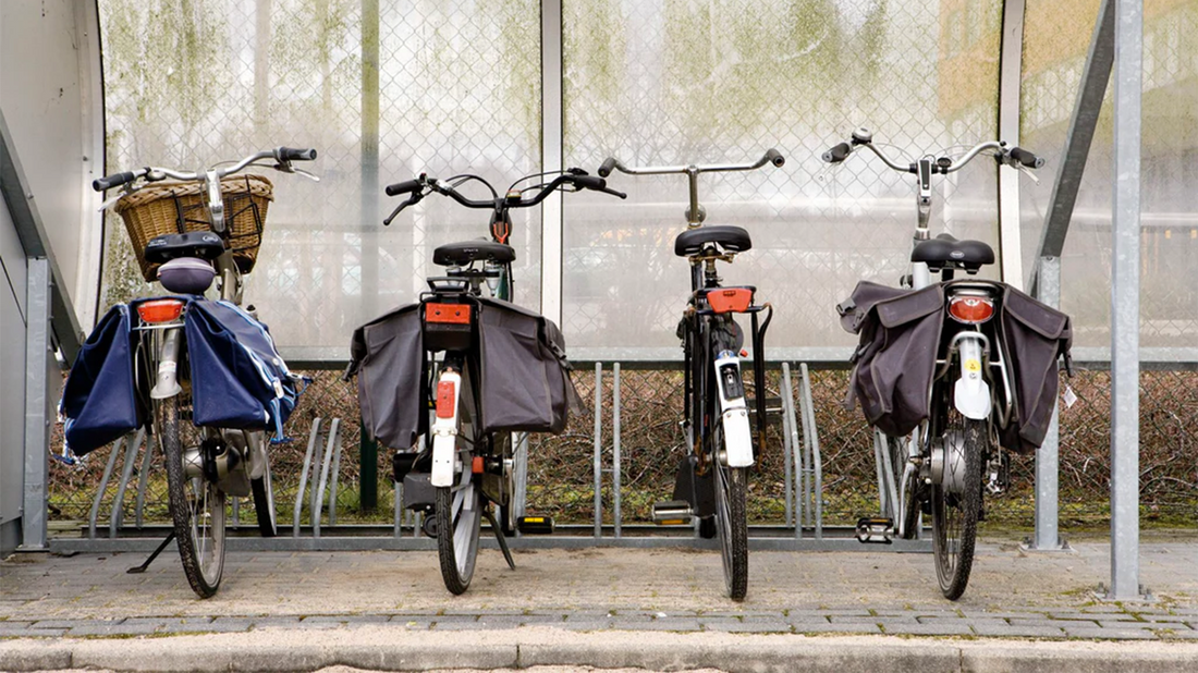 4 back view bicycles with pannier bags