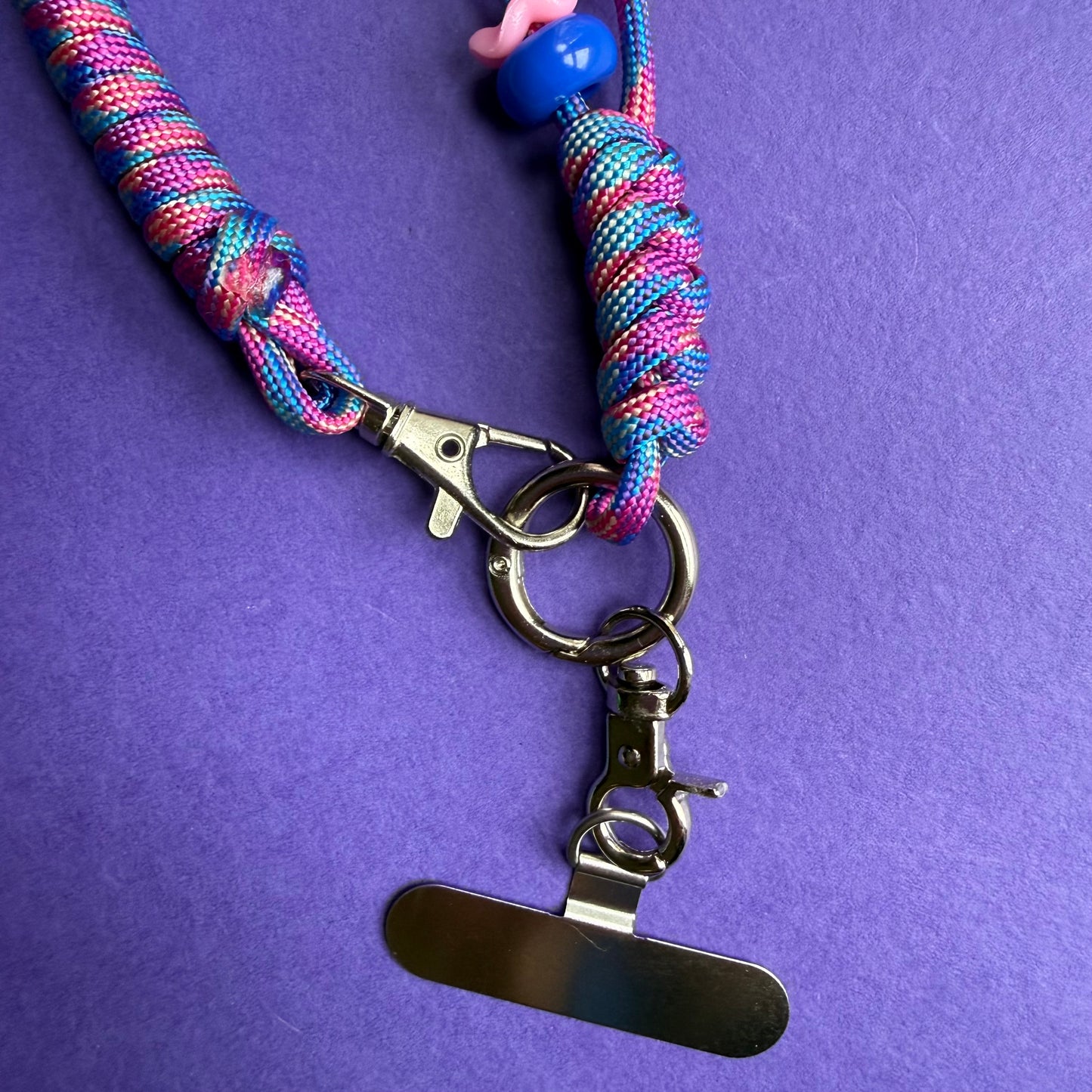 Phone wrist strap with fidget beads