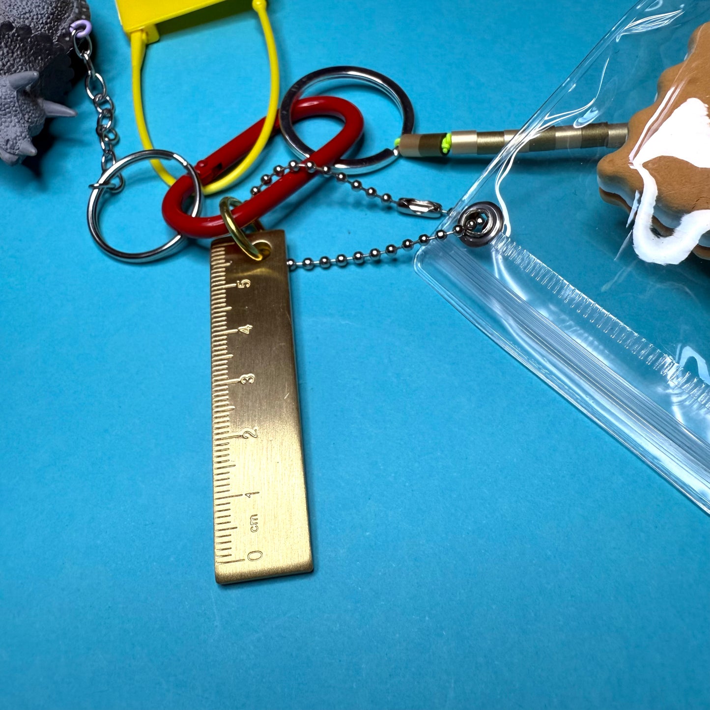 Bag charm and keyring gold ruler dinosaur