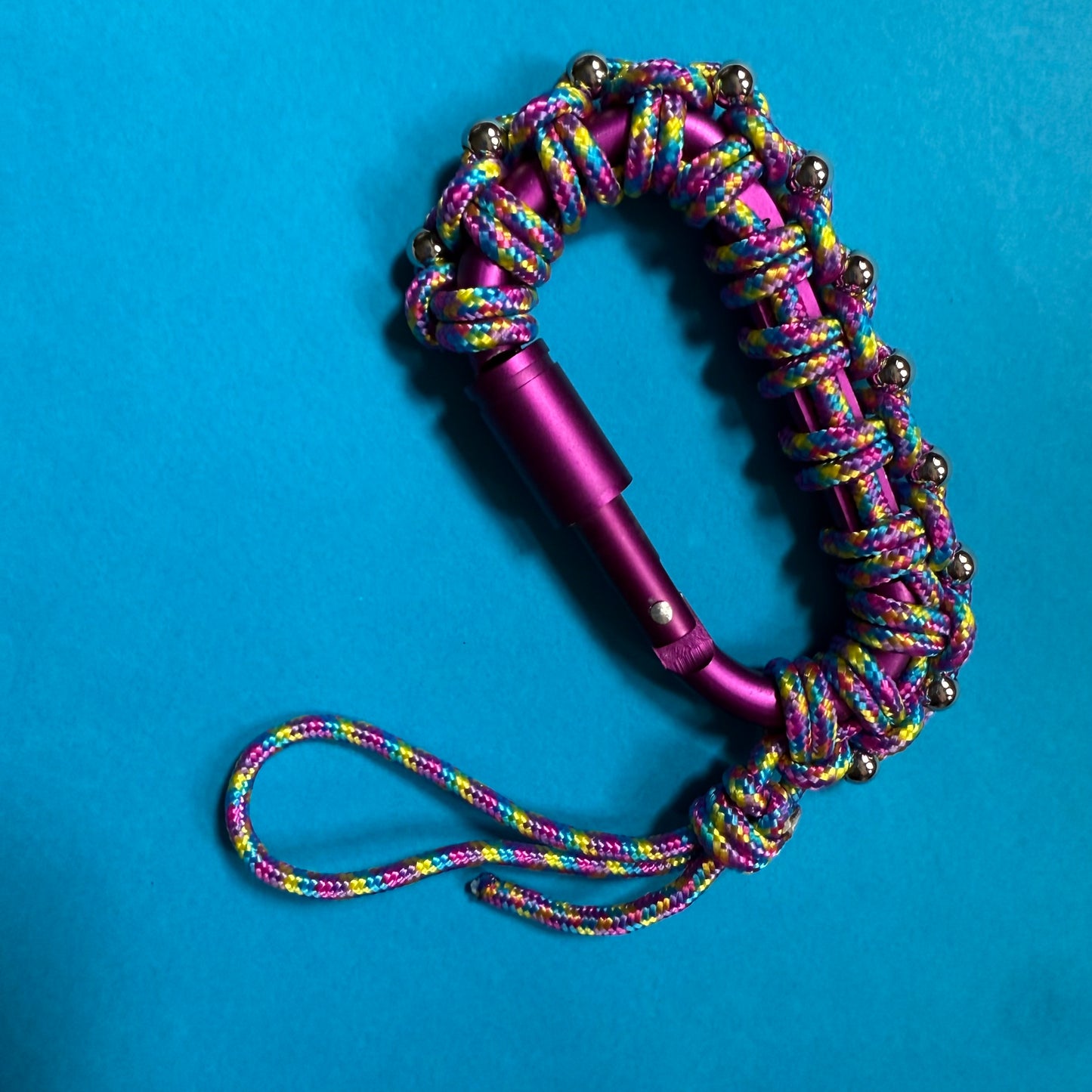 Paracord wrapped carabiner plum