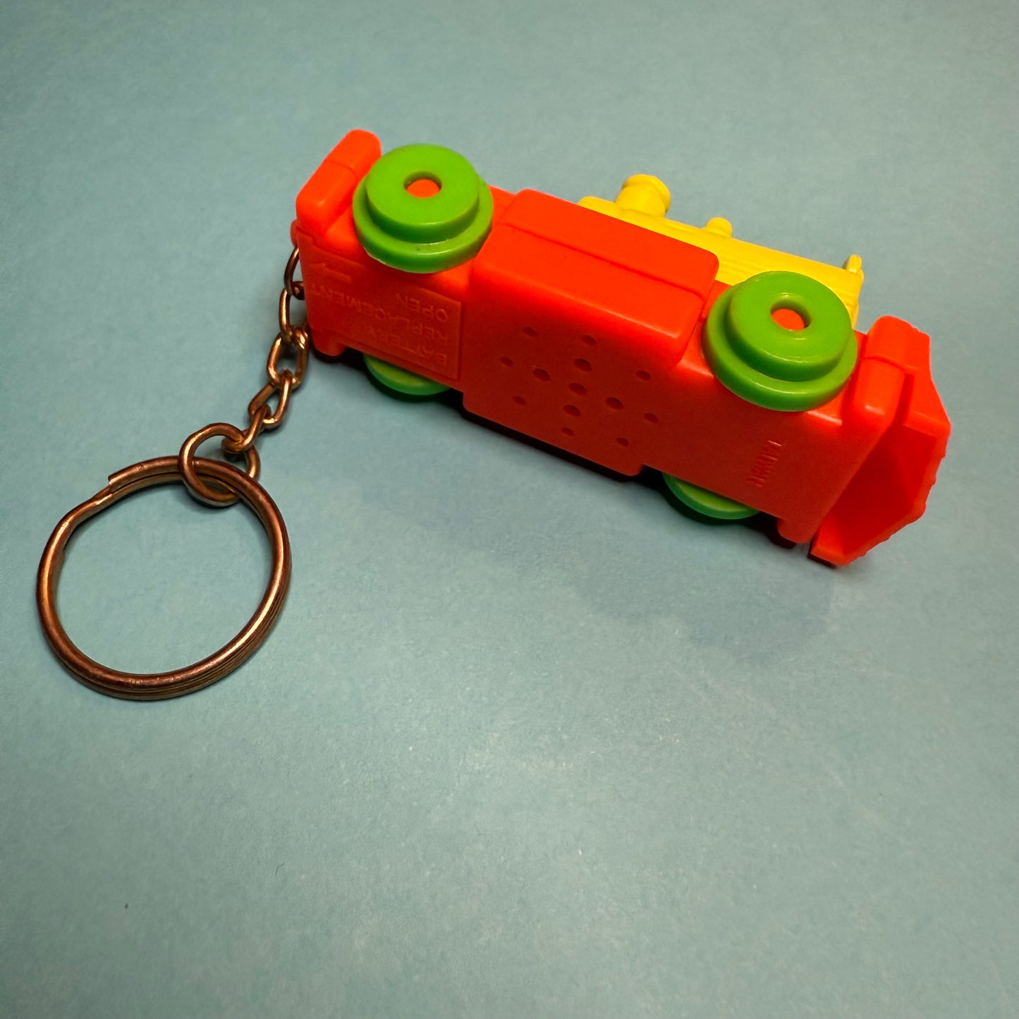 Neon 80s mini train engine charm keyring