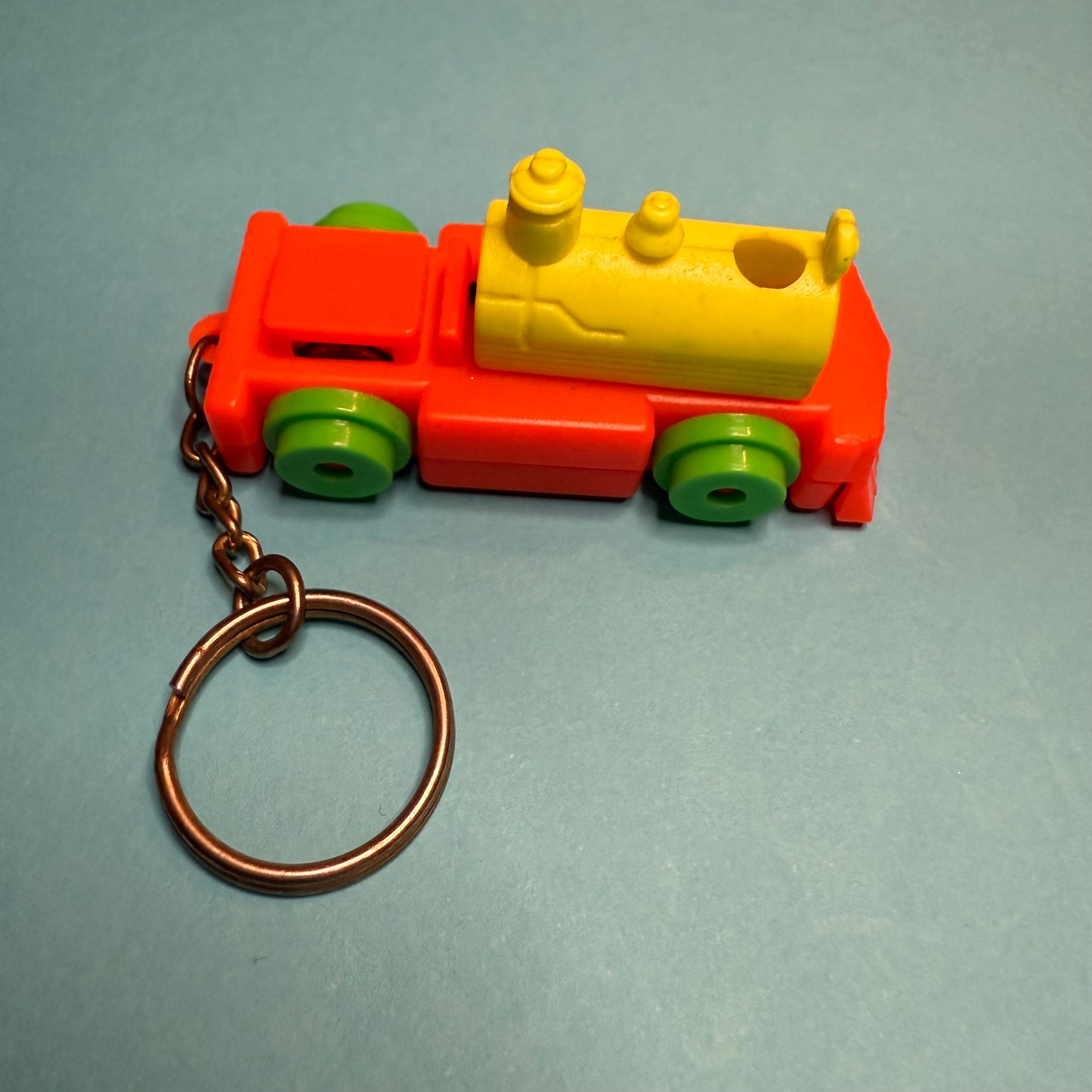 Neon 80s mini train engine charm keyring