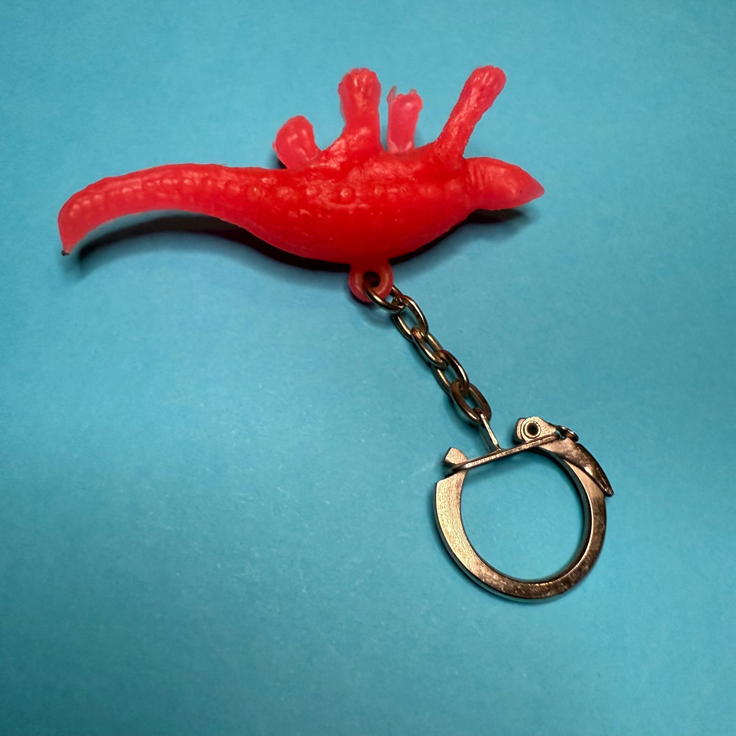 Neon 80s mini dinosaur charm keyring