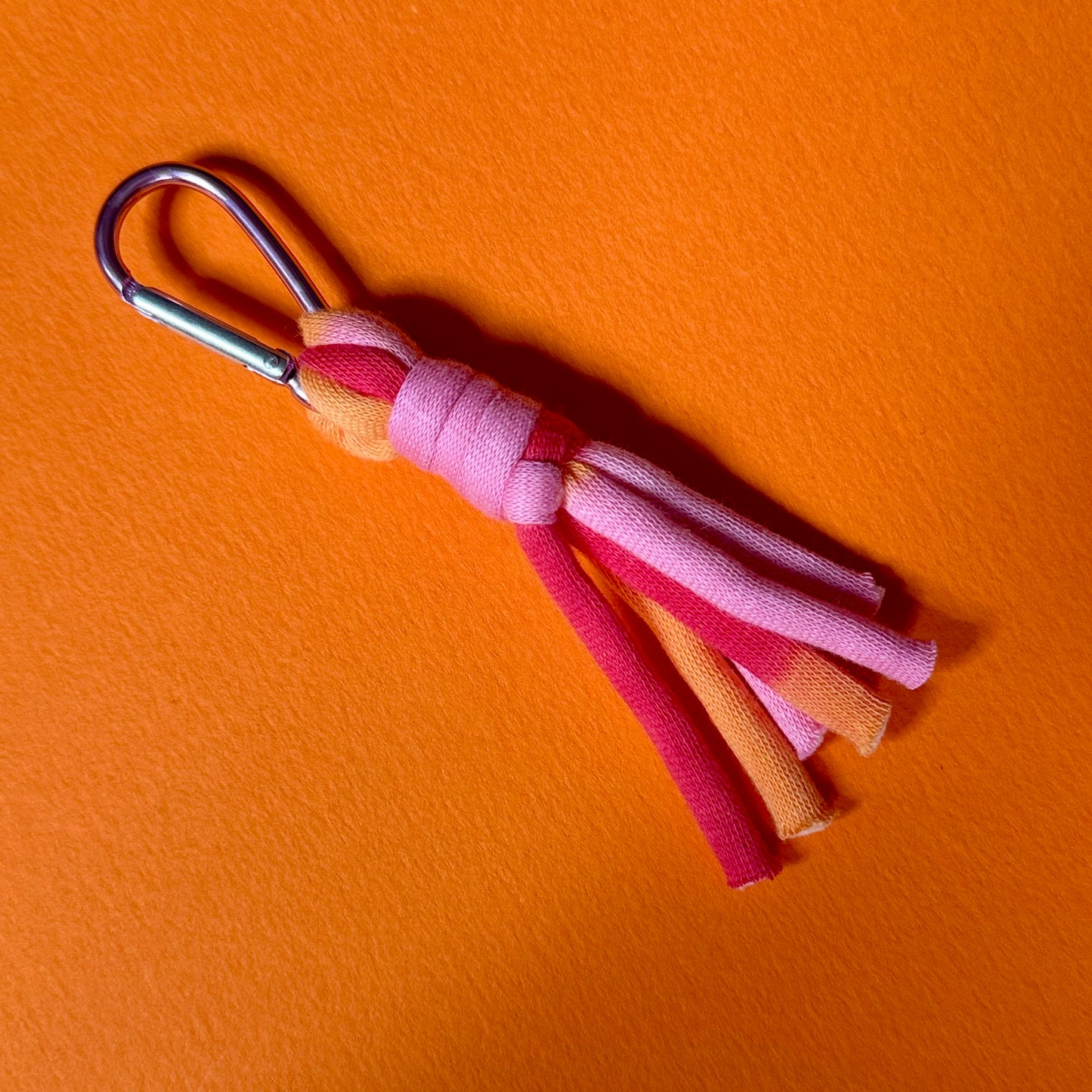 Braided jersey charm