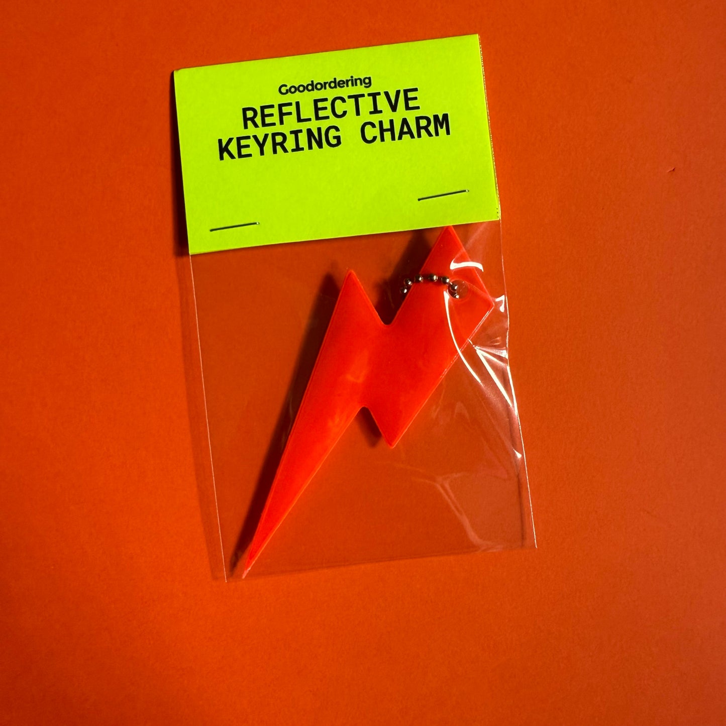 Neon bolt light reflector charm