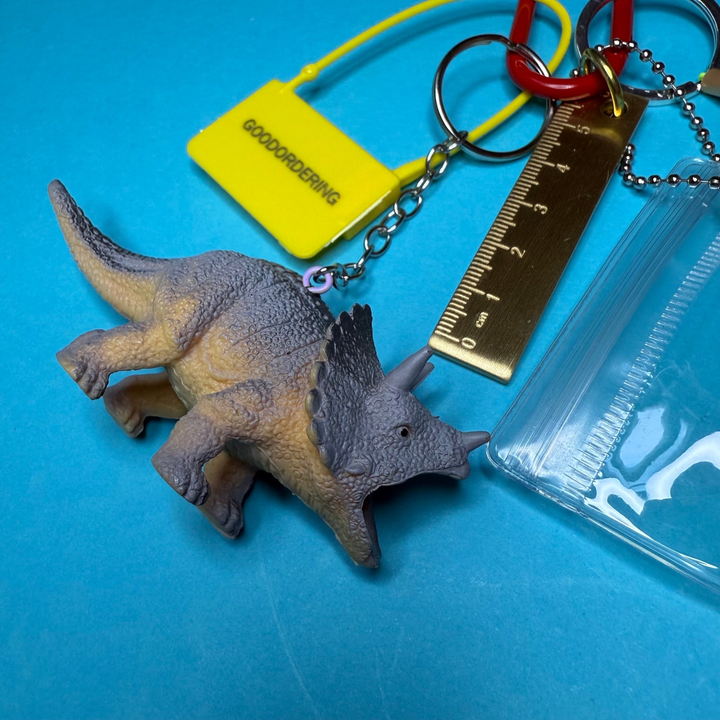 Bag charm and keyring gold ruler dinosaur