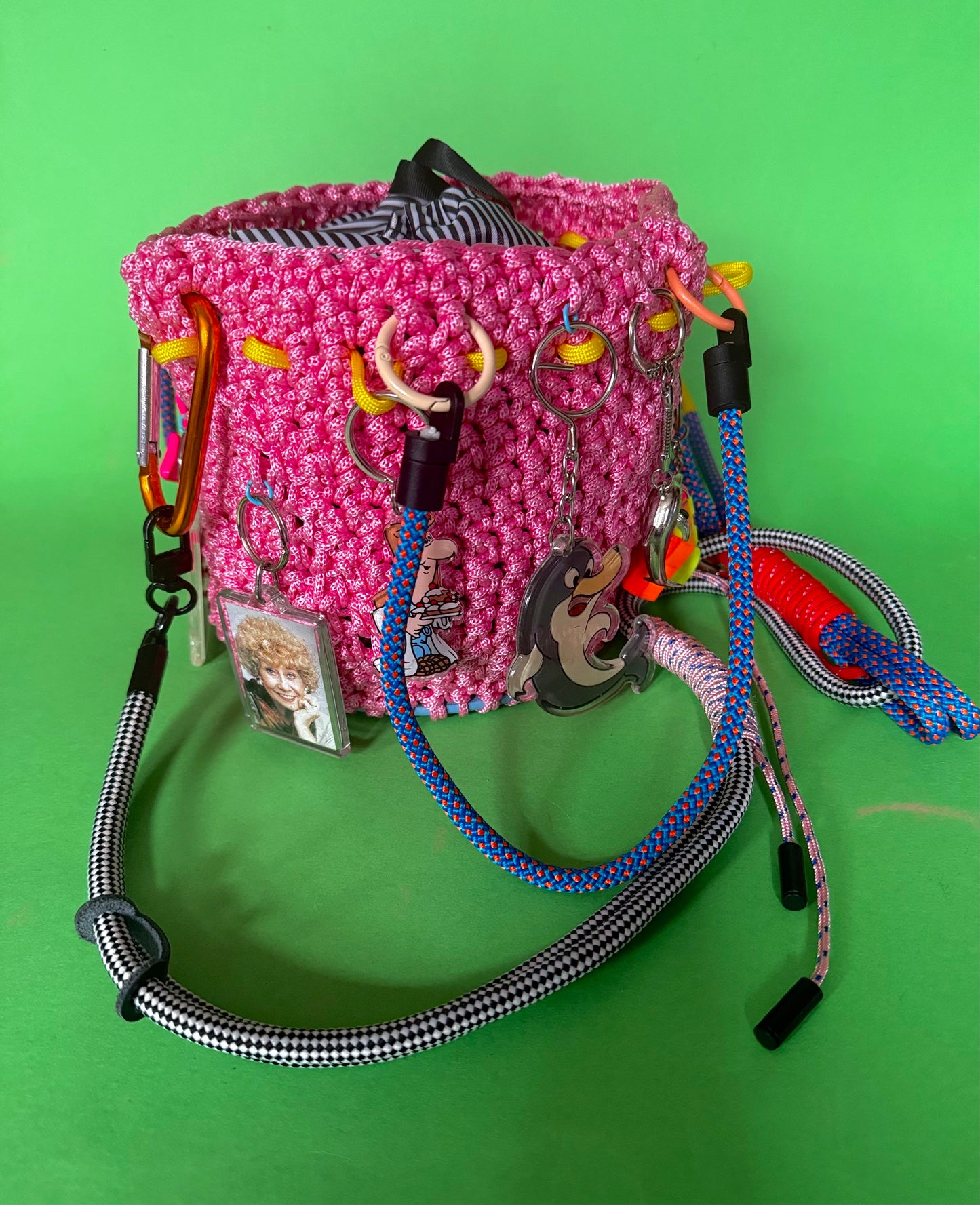 Crocheted bucket bag with keyring charms
