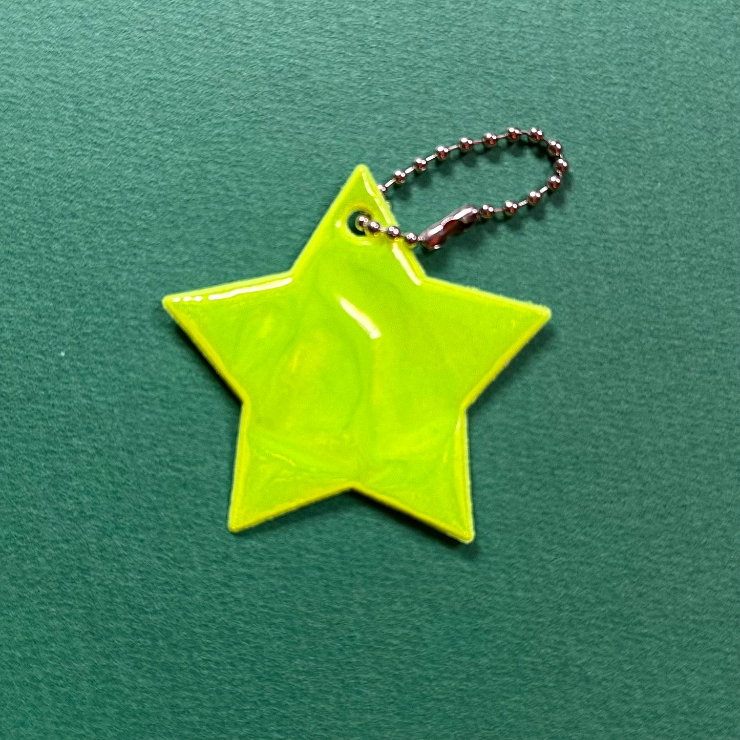 Neon star light reflector charm