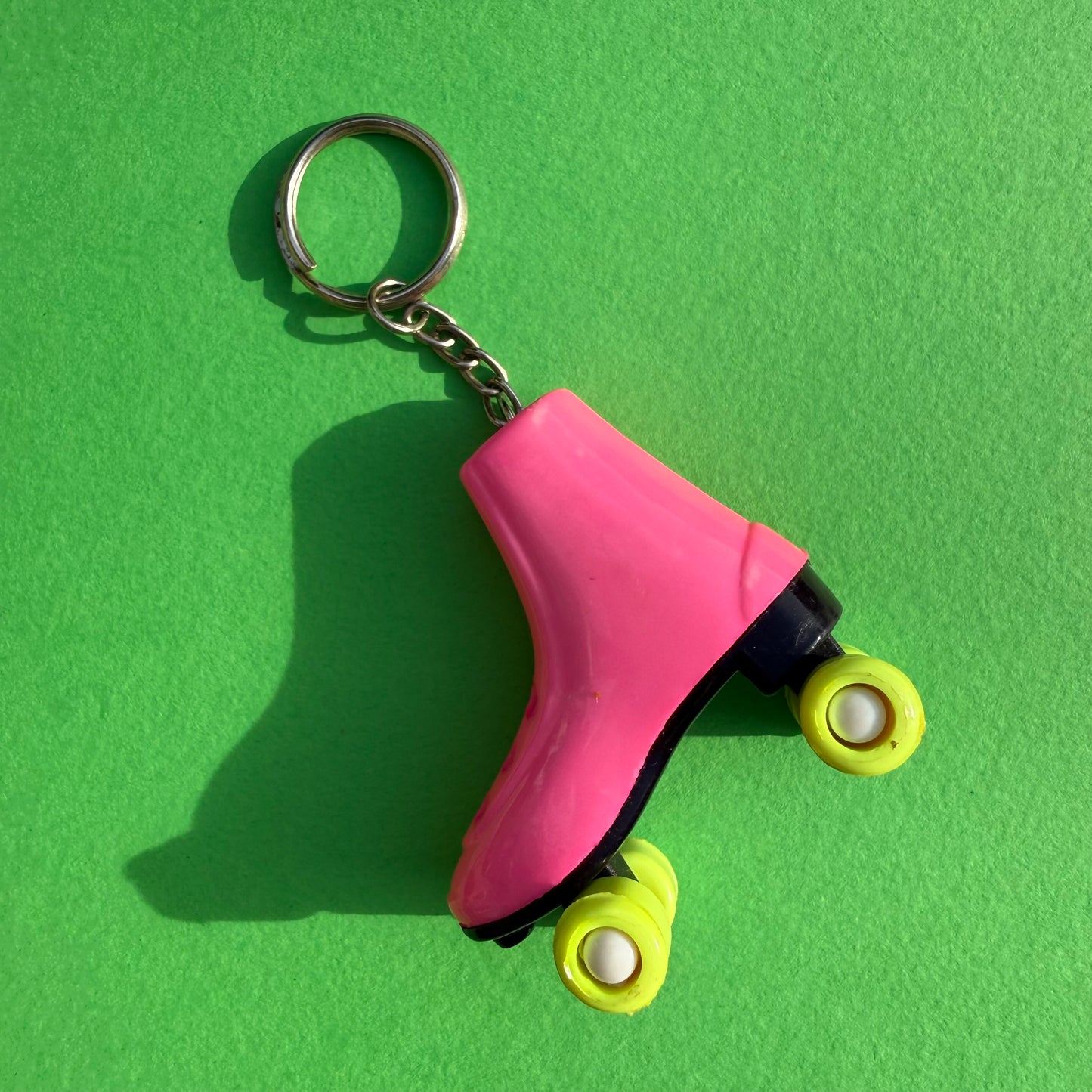 Neon 80s mini pink roller skate charm keyring