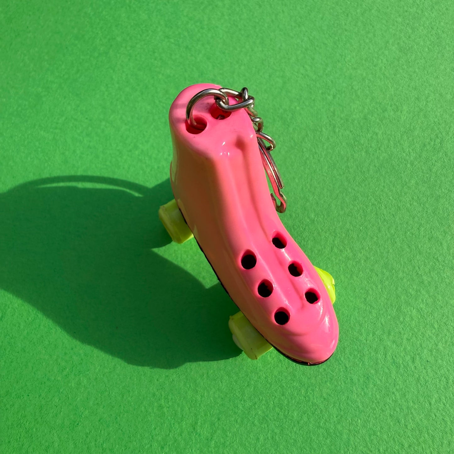 Neon 80s mini pink roller skate charm keyring