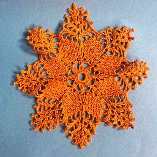 Orange crocheted doiley vintage