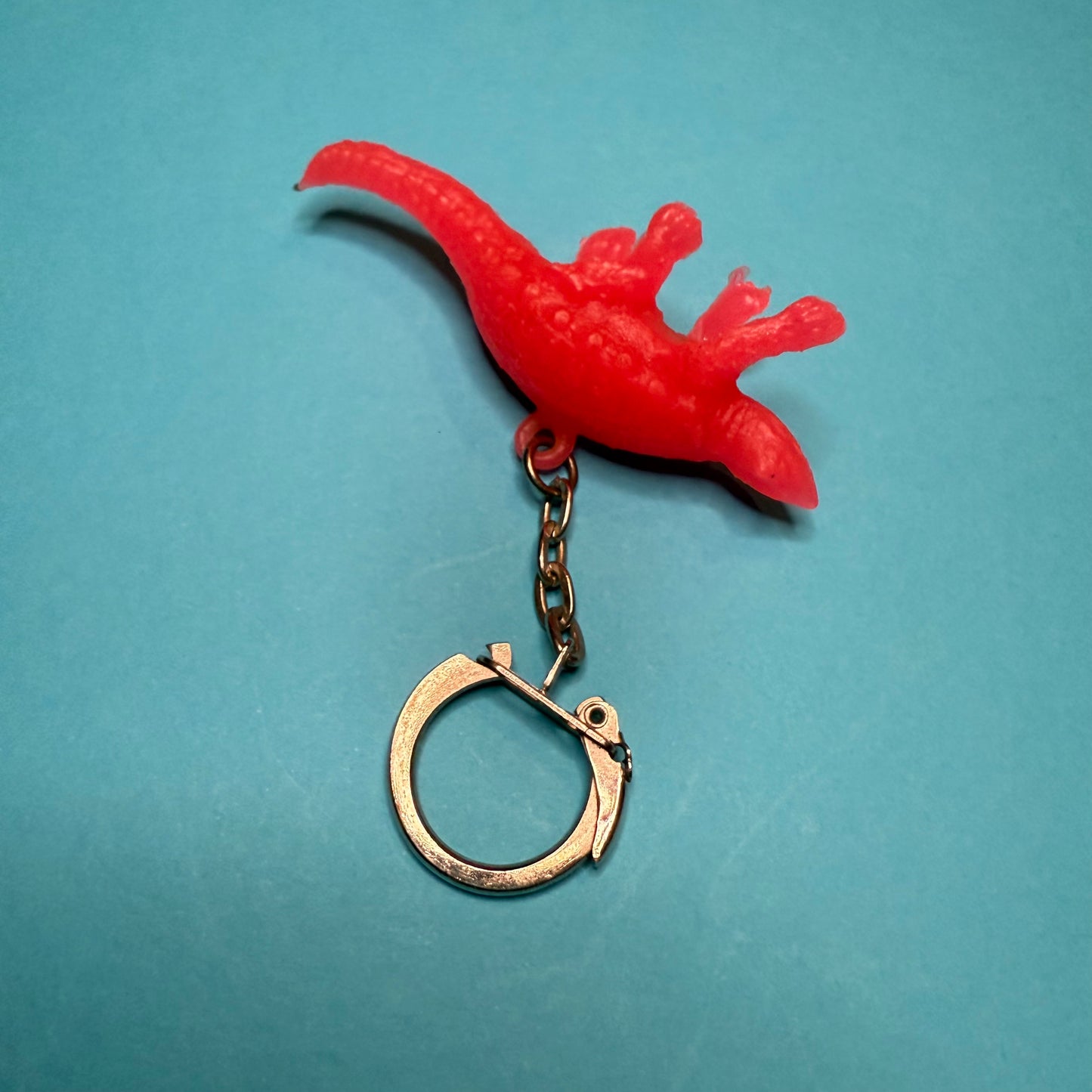 Neon 80s mini dinosaur charm keyring