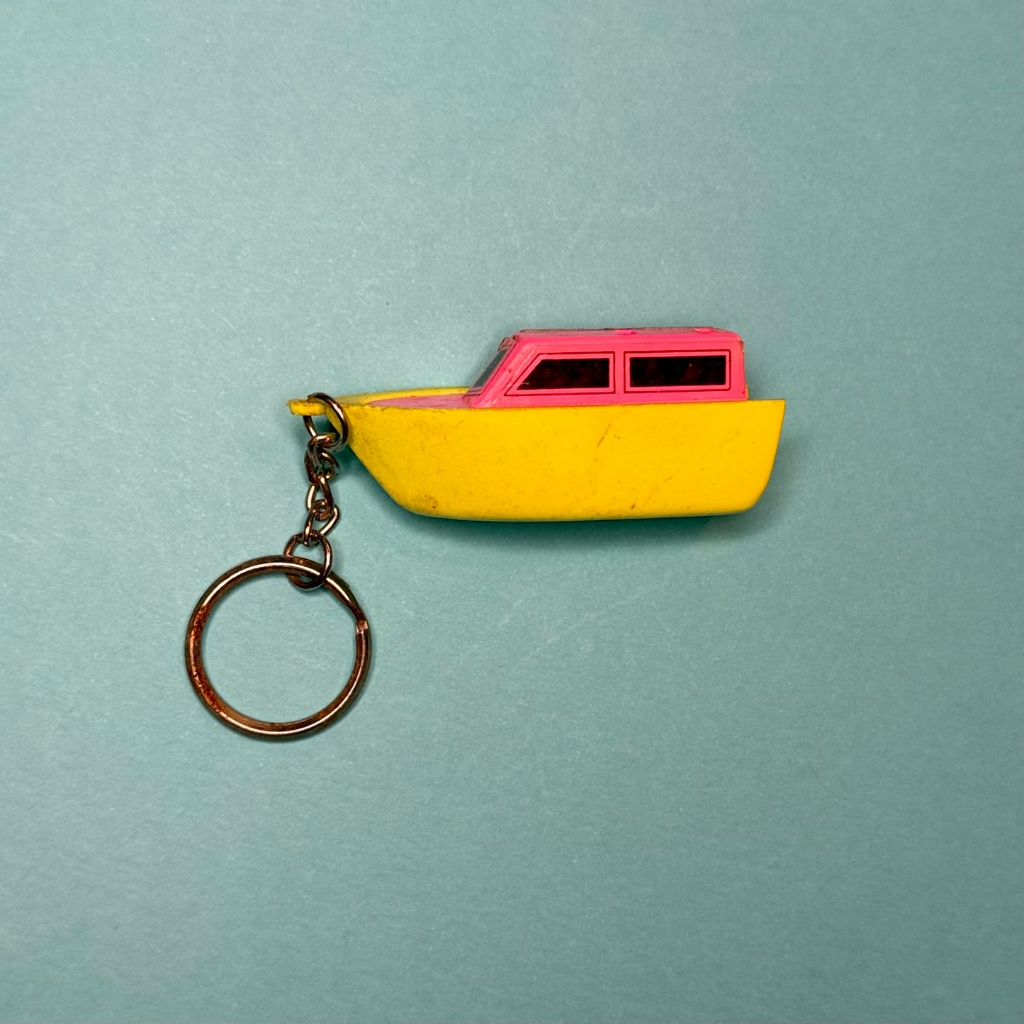 Neon 80s mini speed boat charm keyring