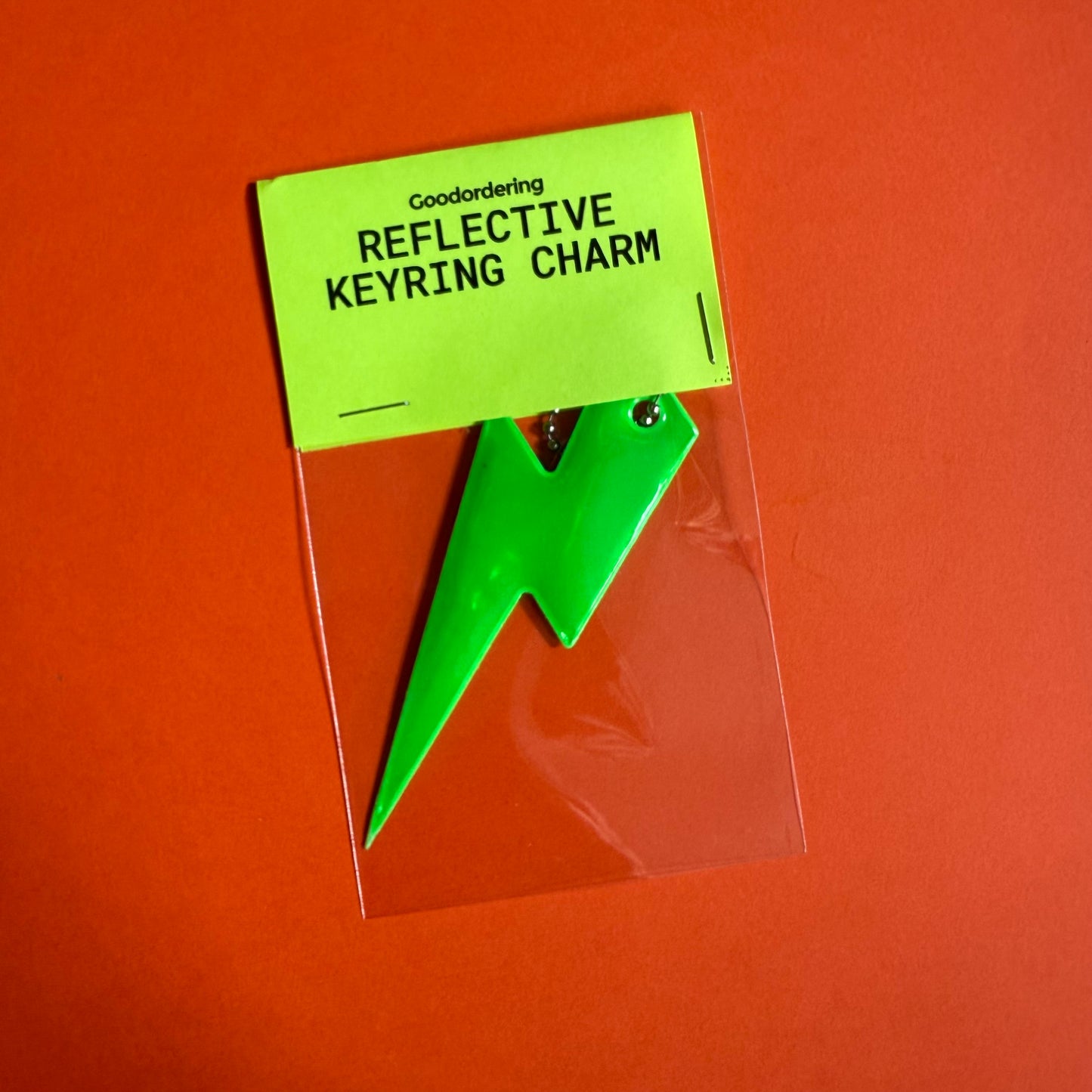 Neon bolt light reflector charm