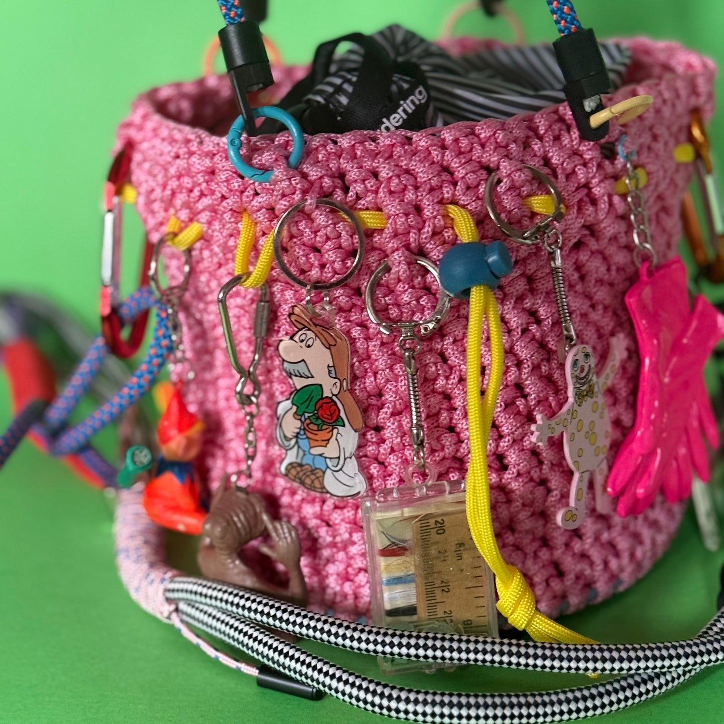 Crocheted bucket bag with keyring charms