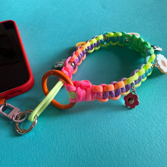 Phone wristler strap with charms