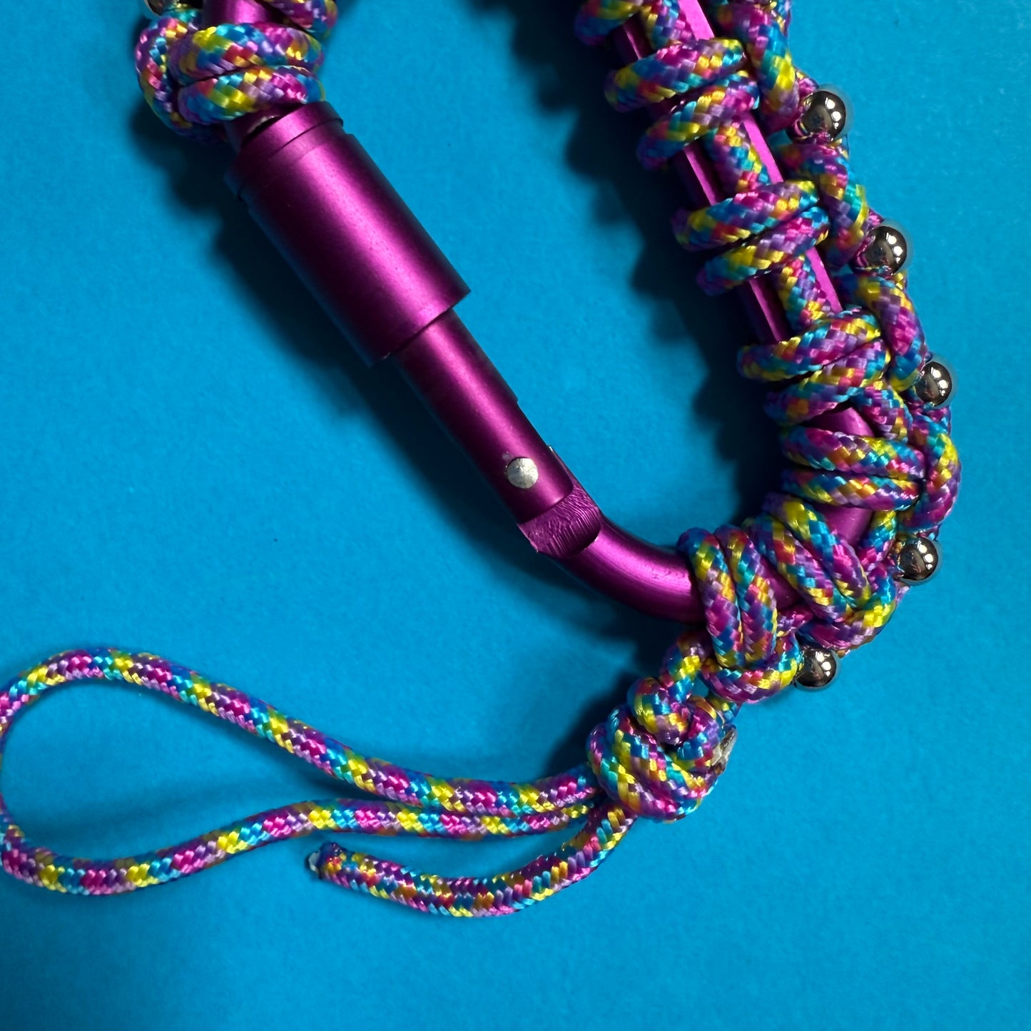 Paracord wrapped carabiner plum