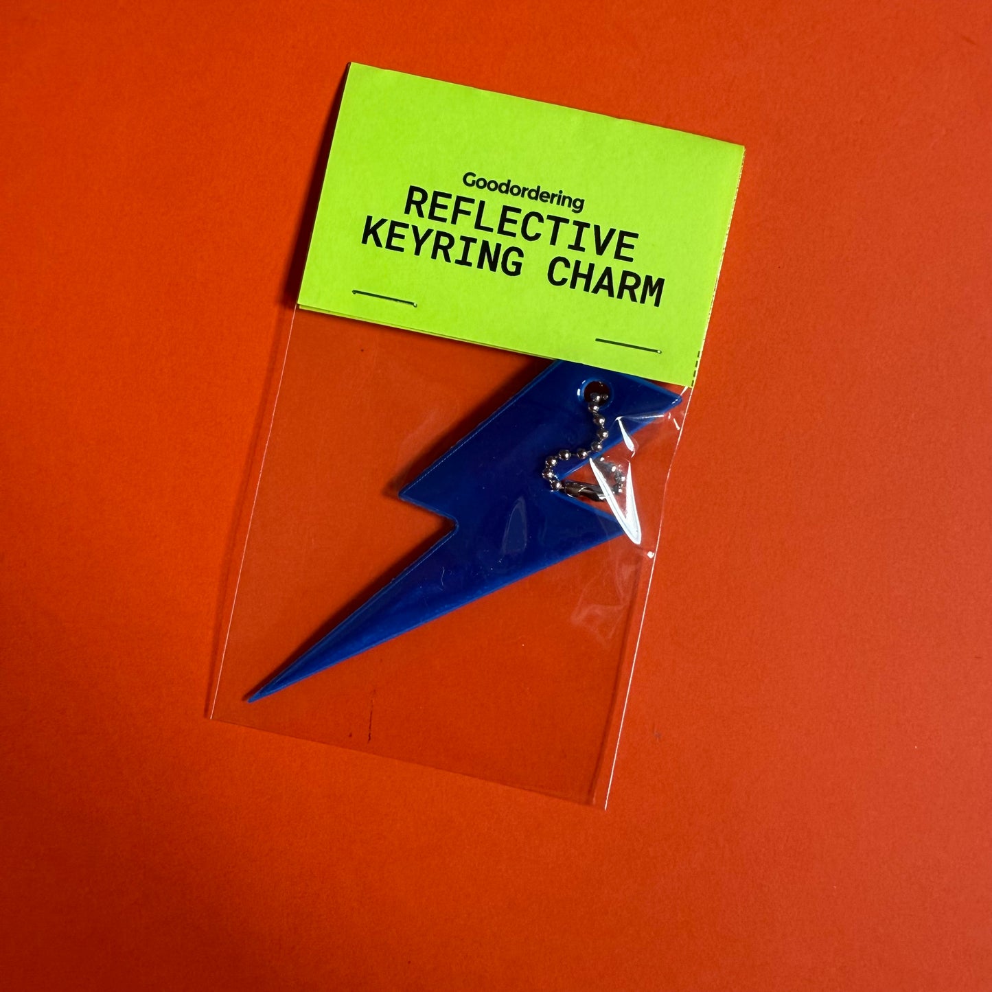 Neon bolt light reflector charm