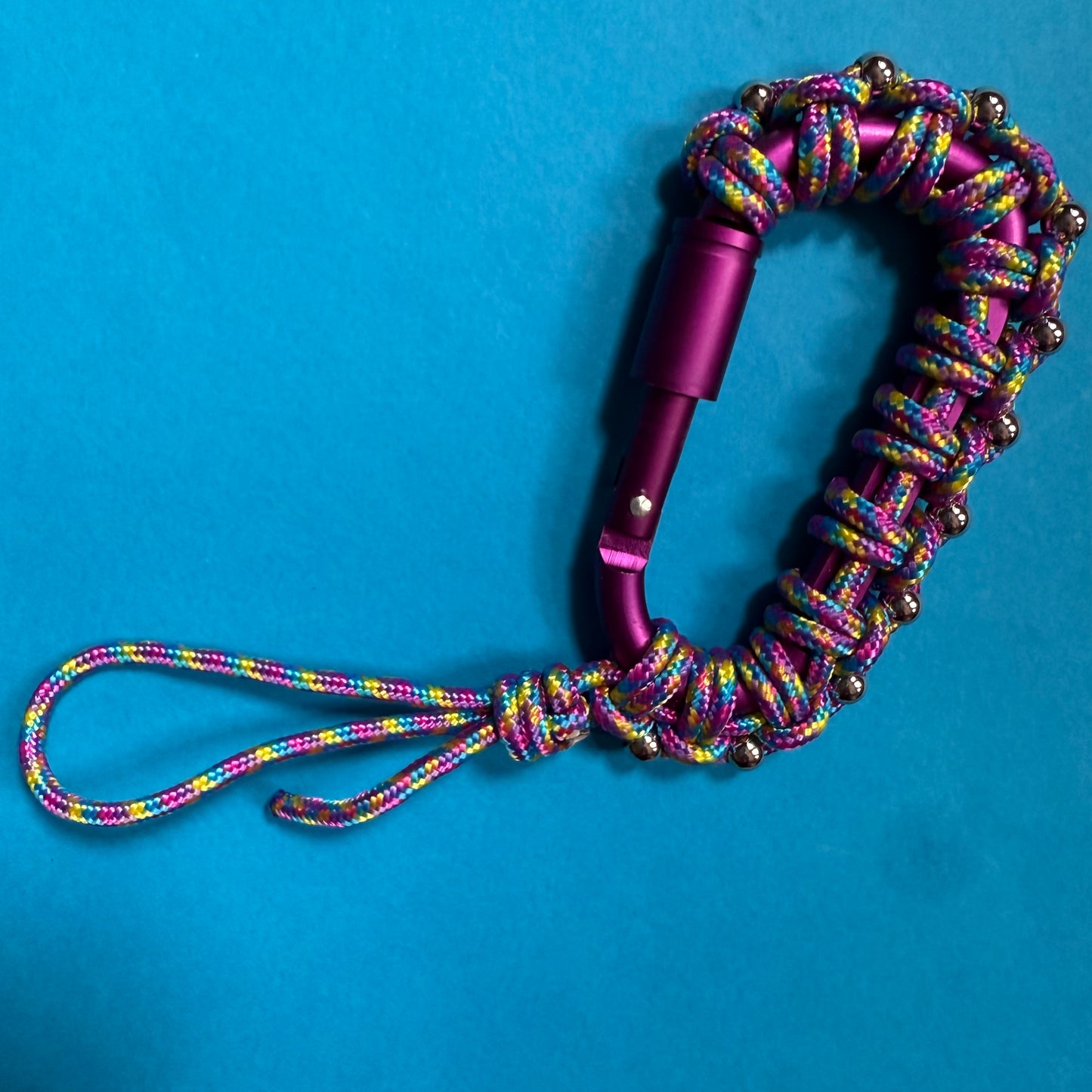 Paracord wrapped carabiner plum