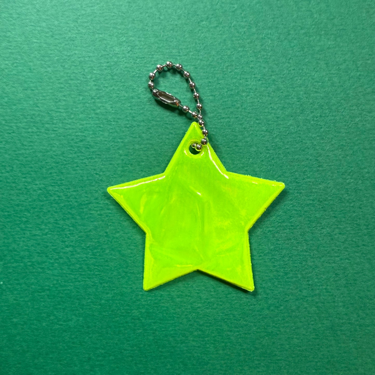 Neon star light reflector charm