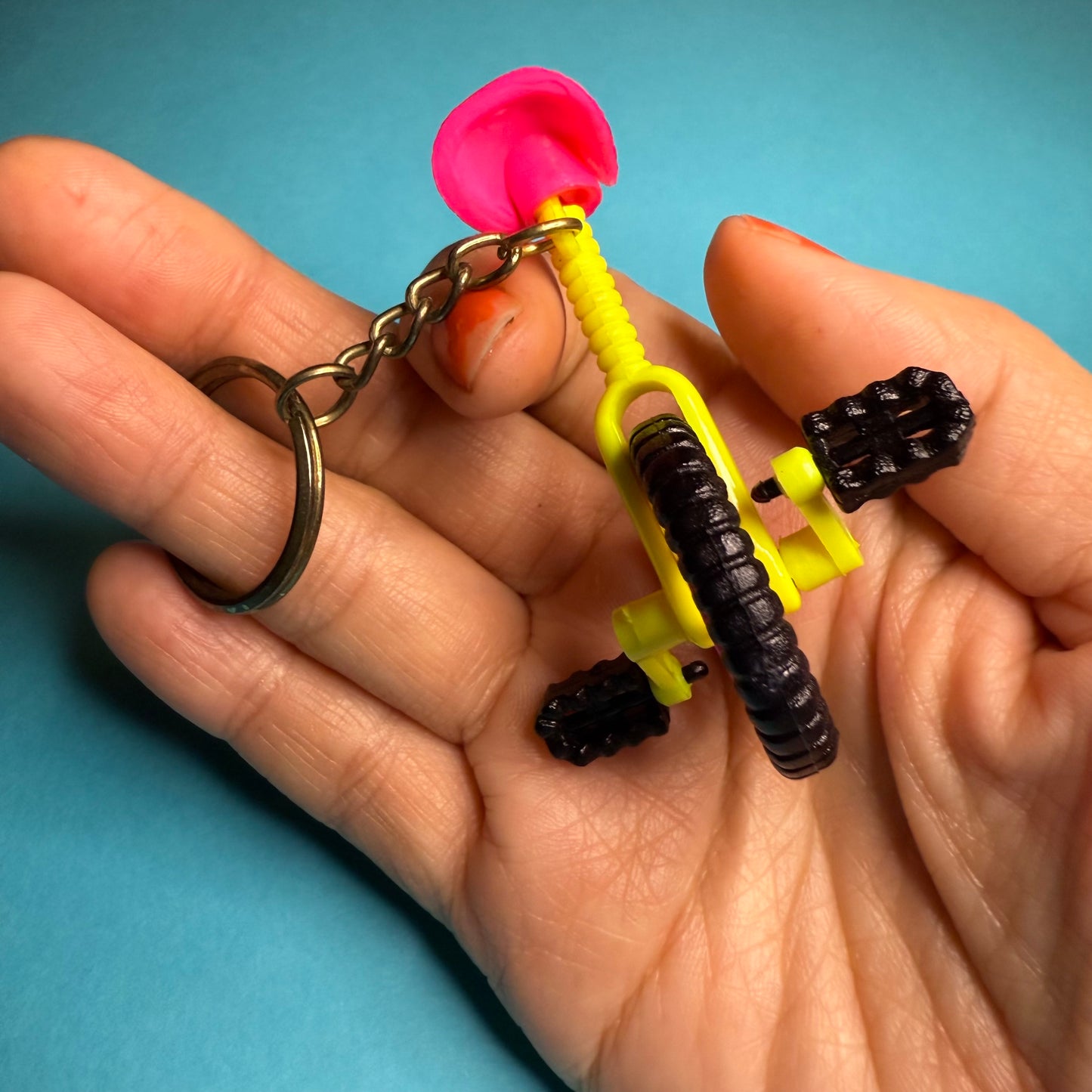 Neon 80s mini unicycle charm keyring