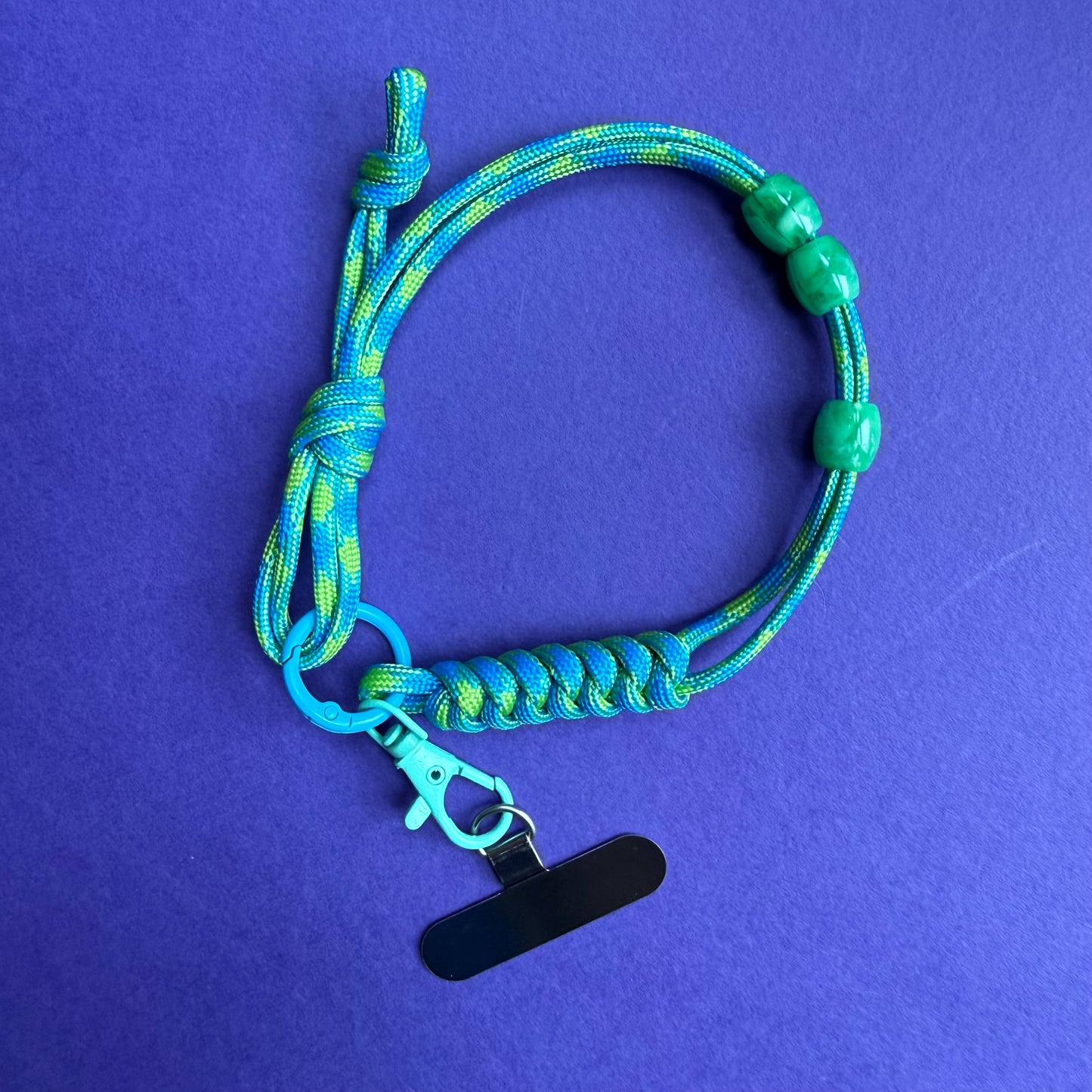 Phone wrist strap with fidget beads