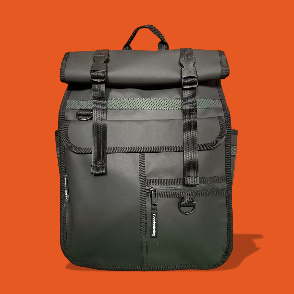 Gray backpack with black straps on an orange background Goodordering ECO black monochrome rolltop backpack pannier