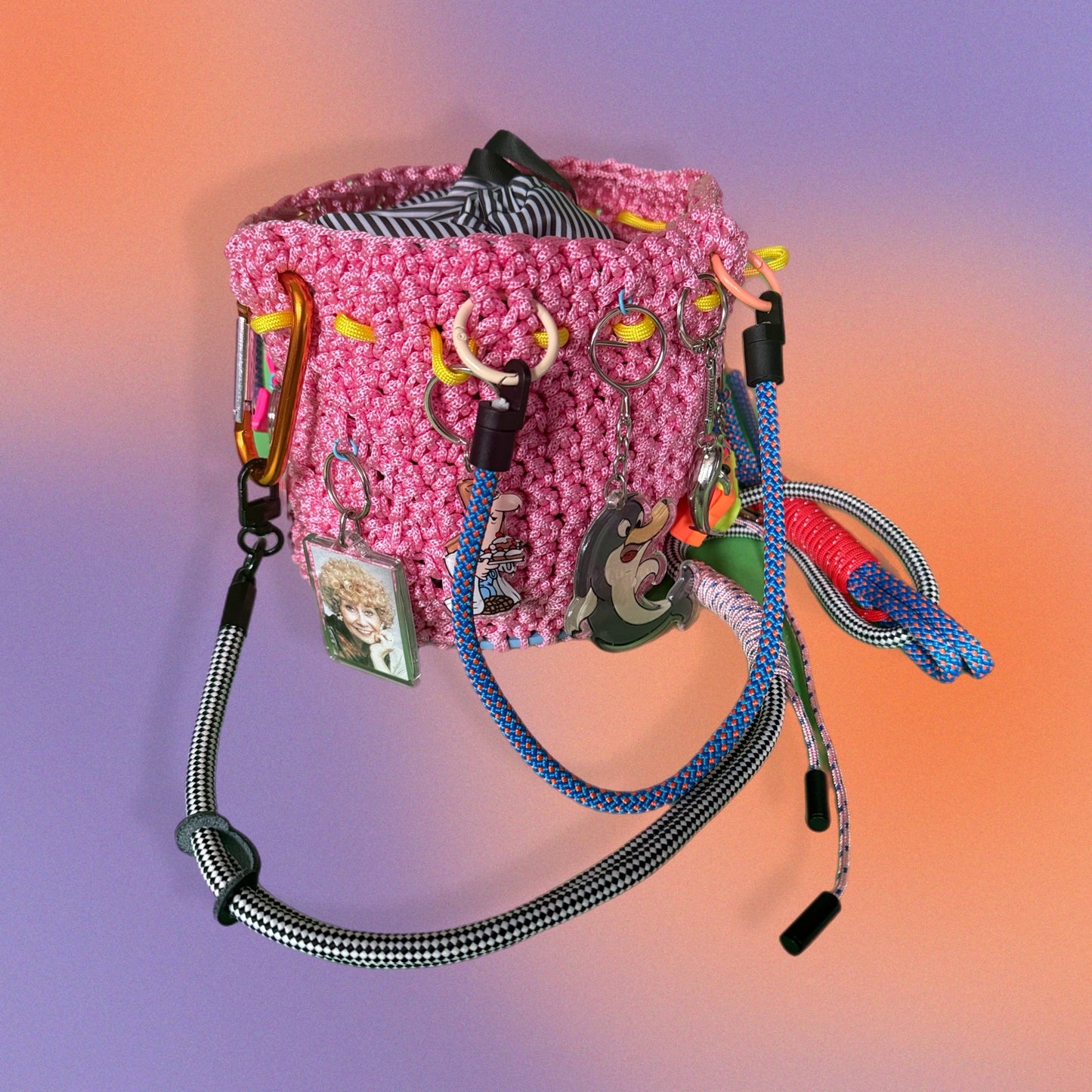Crocheted bucket bag with keyring charms