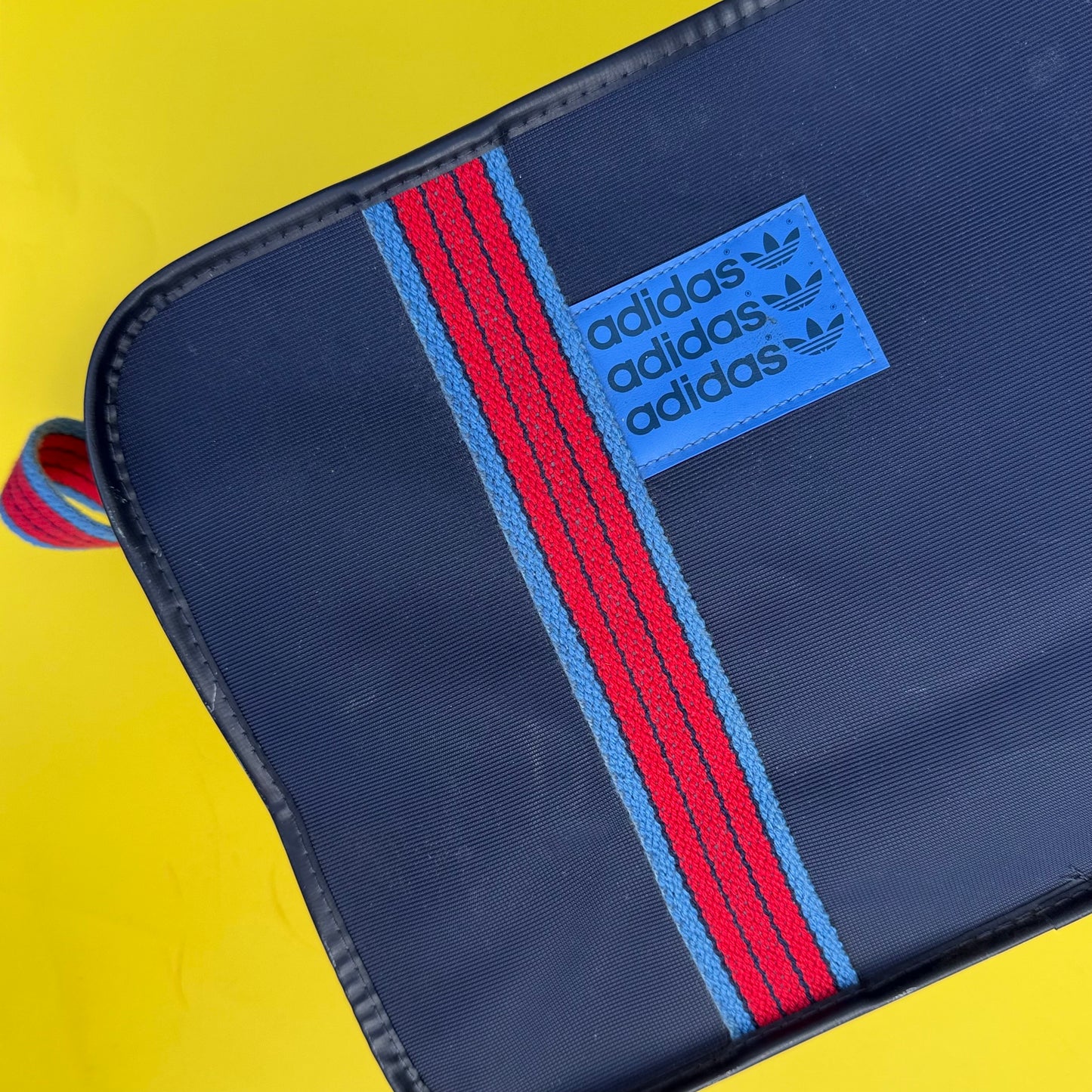 Navy adidas canvas messenger bag with bicycle pannier attachment