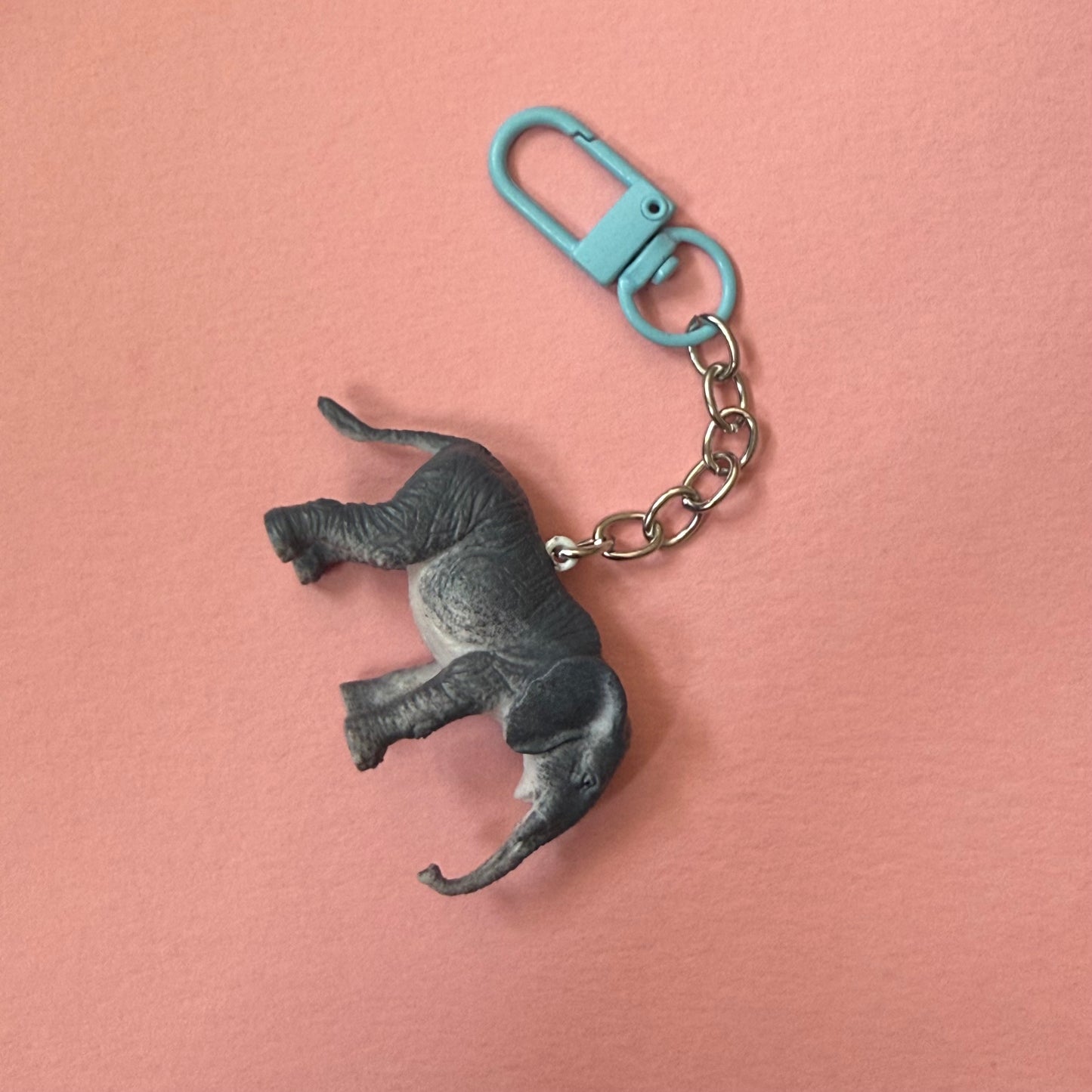 Keychain with elephant design on a pink background