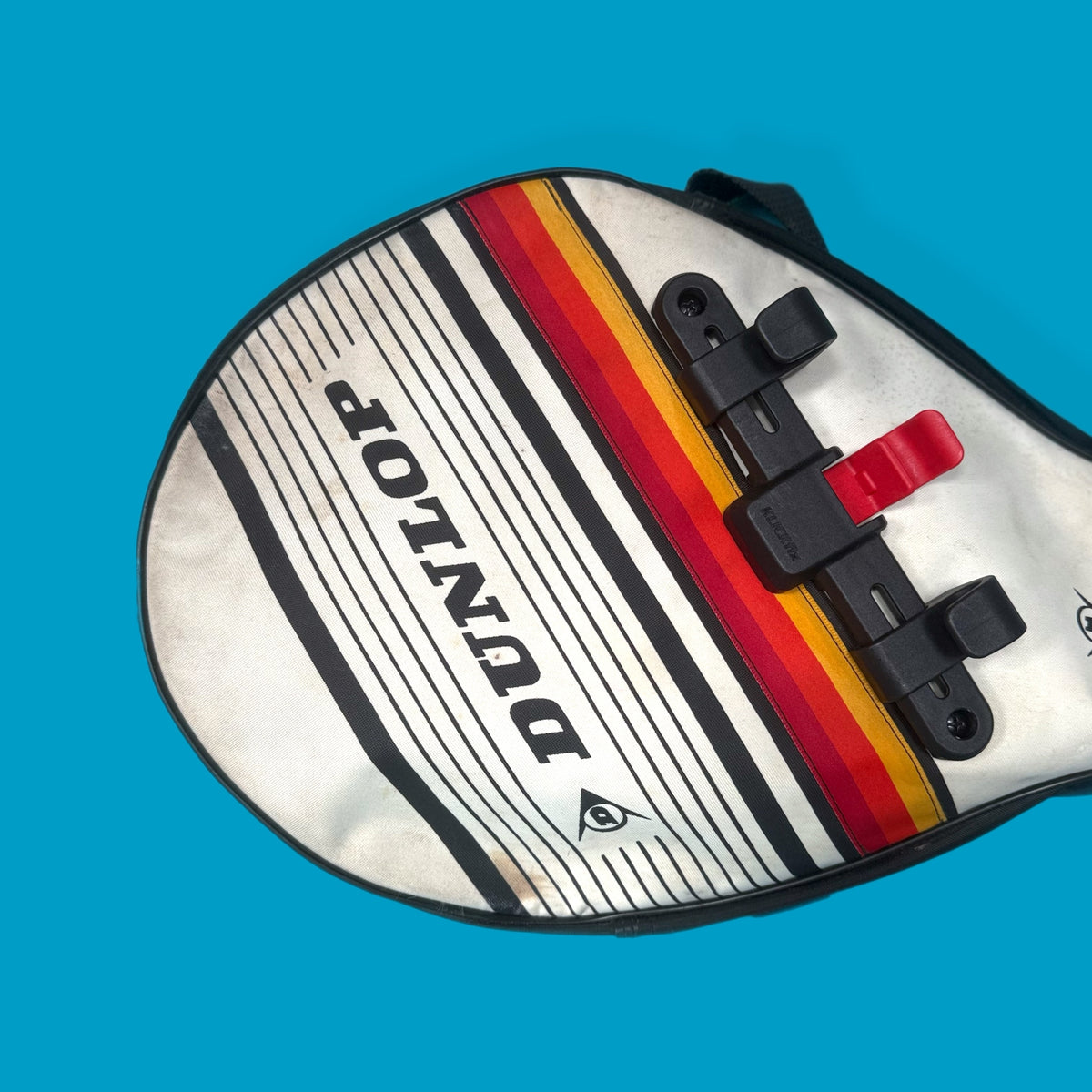 Vintage tennis racket bag used as a bike pannier