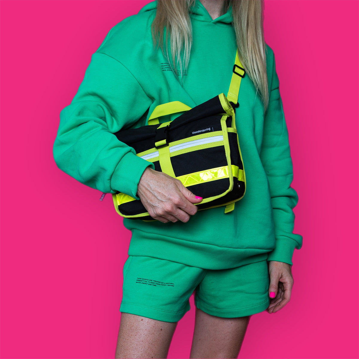 Neon Handlebar bag satchel black - Goodordering on model with green tracksuit 
