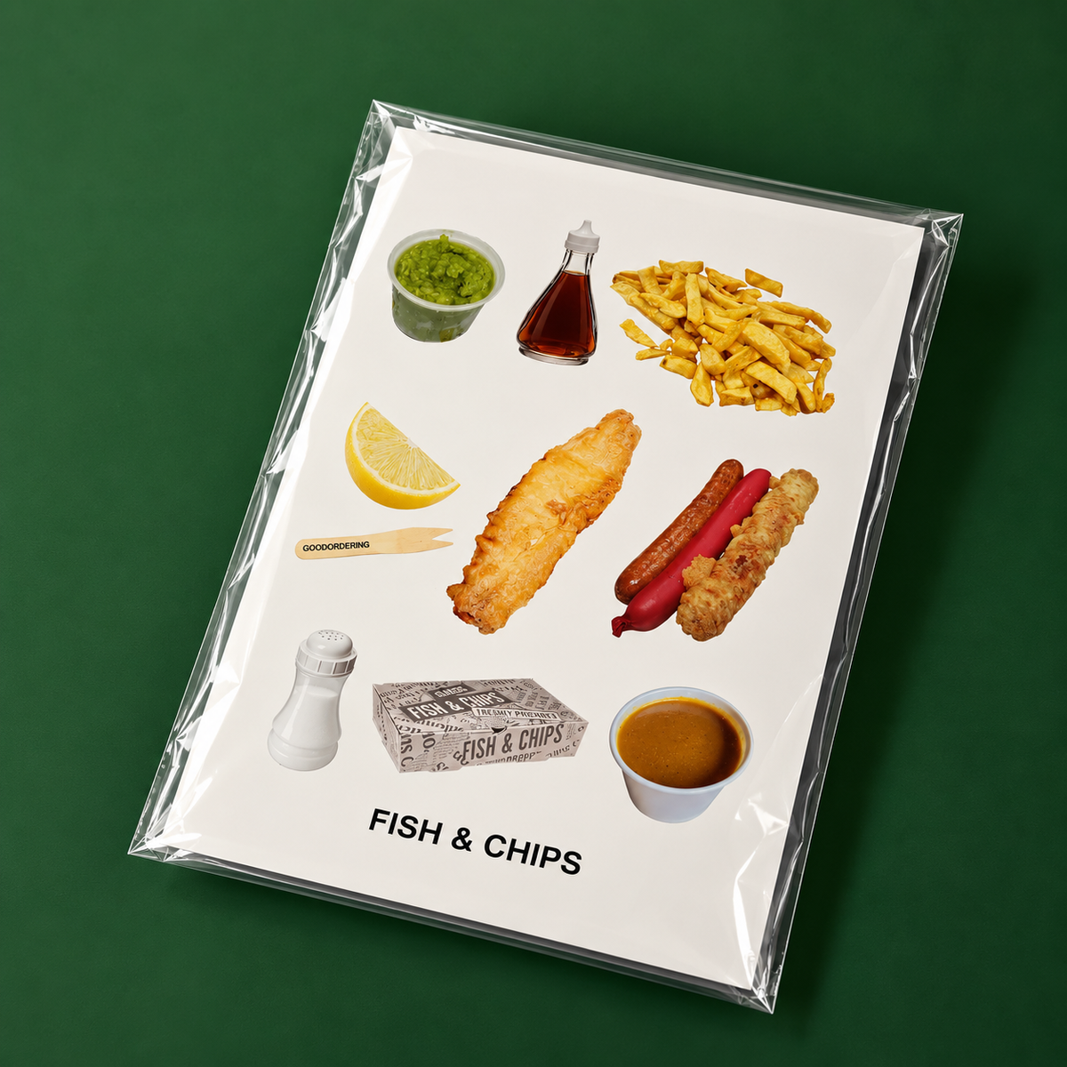 A square art print featuring a collage of classic fish and chips ingredients and foods, enclosed in a clear plastic sleeve and set against a solid dark green background. The print includes french fries, fish fingers, a hot dog, tartar sauce, tartar chips, lemon, tartar sauce, and a cup of chips. gift wrapped in cellophane
