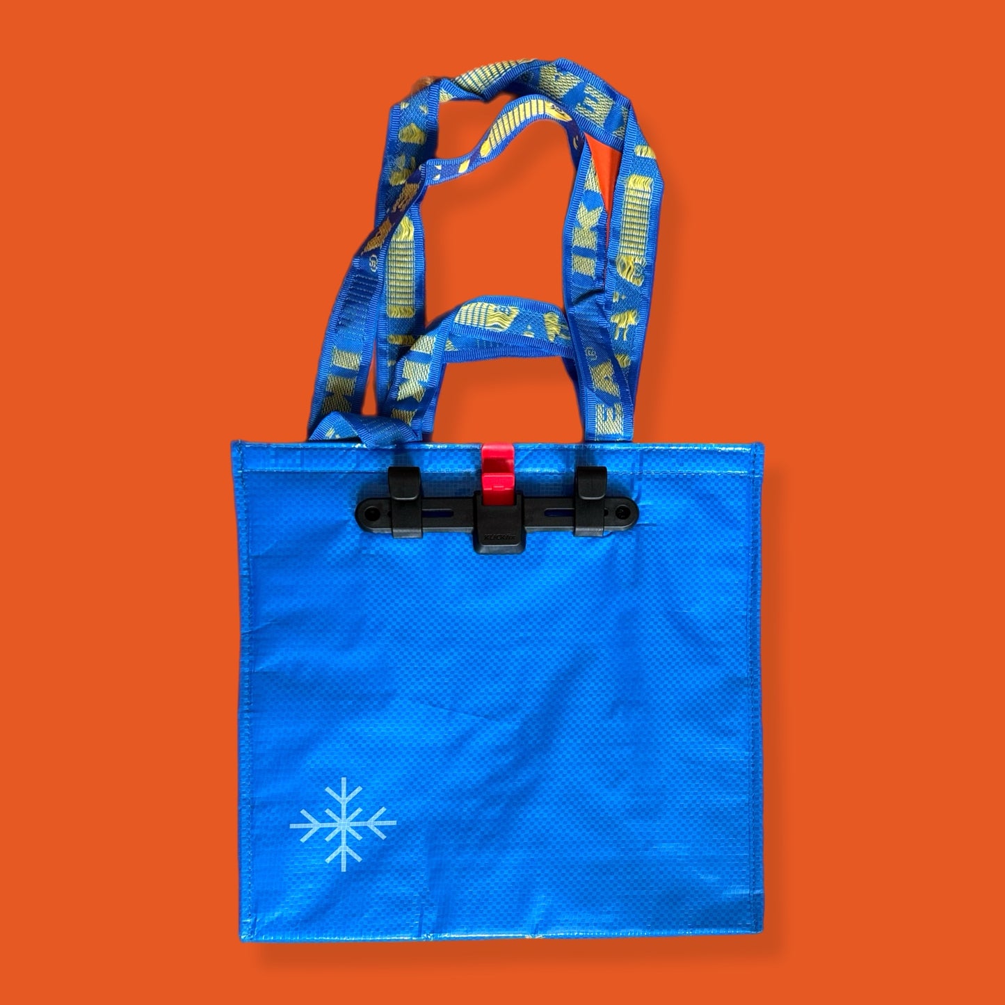 Blue tote bag with a snowflake design on an orange background insulated bag ikea 