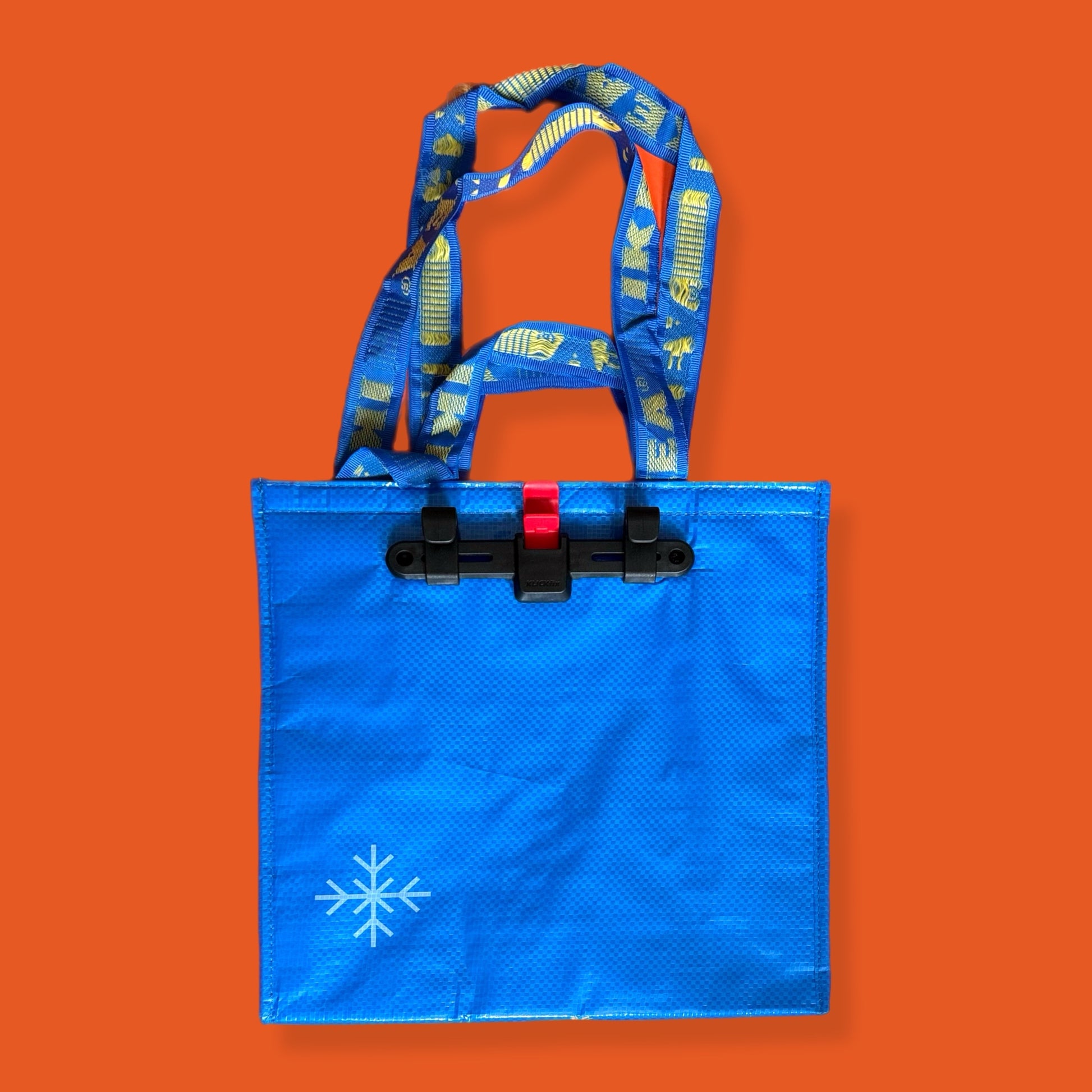 Blue tote bag with a snowflake design on an orange background insulated bag ikea 