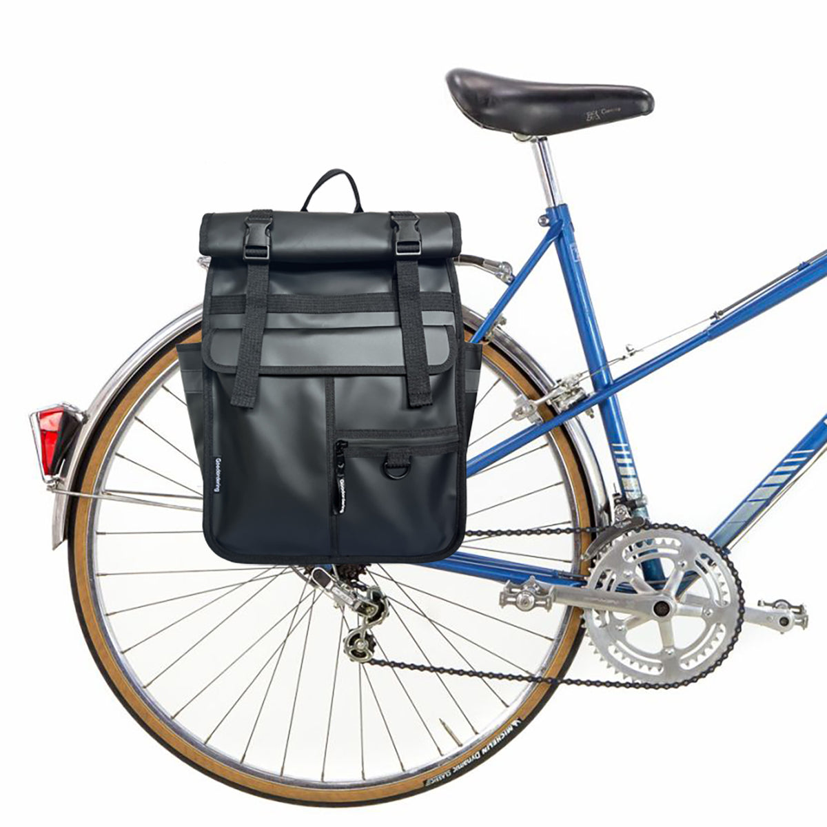 Matt Black rolltop backpack Goodordering Black recycled rolltop backpack attached to a bicycle pannier rack