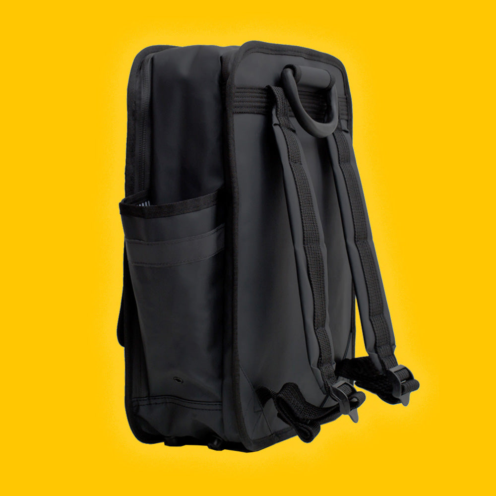 Matt black boxy backpack with outside side pockets and two front velcro pcokets and one zip pocket. Laptop pocket and waterproof material.  Monochrome rucksack Goodordering