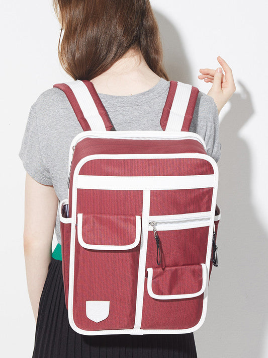 Orange retro boxy backpack with outside side pockets and two front velcro pockets and one zip pocket. Laptop pocket and waterproof material. Orange with white binding rucksack Goodordering