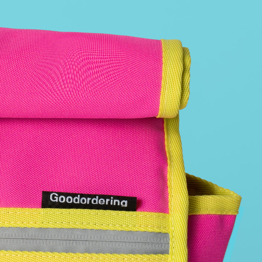 Neon pink and yellow roll top handlebar bag shoulder bag