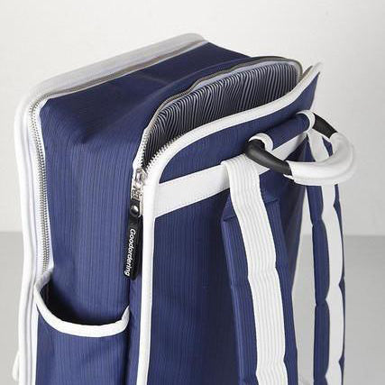 Orange retro boxy backpack with outside side pockets and two front velcro pockets and one zip pocket. Laptop pocket and waterproof material. Navy blue with white binding rucksack Goodordering