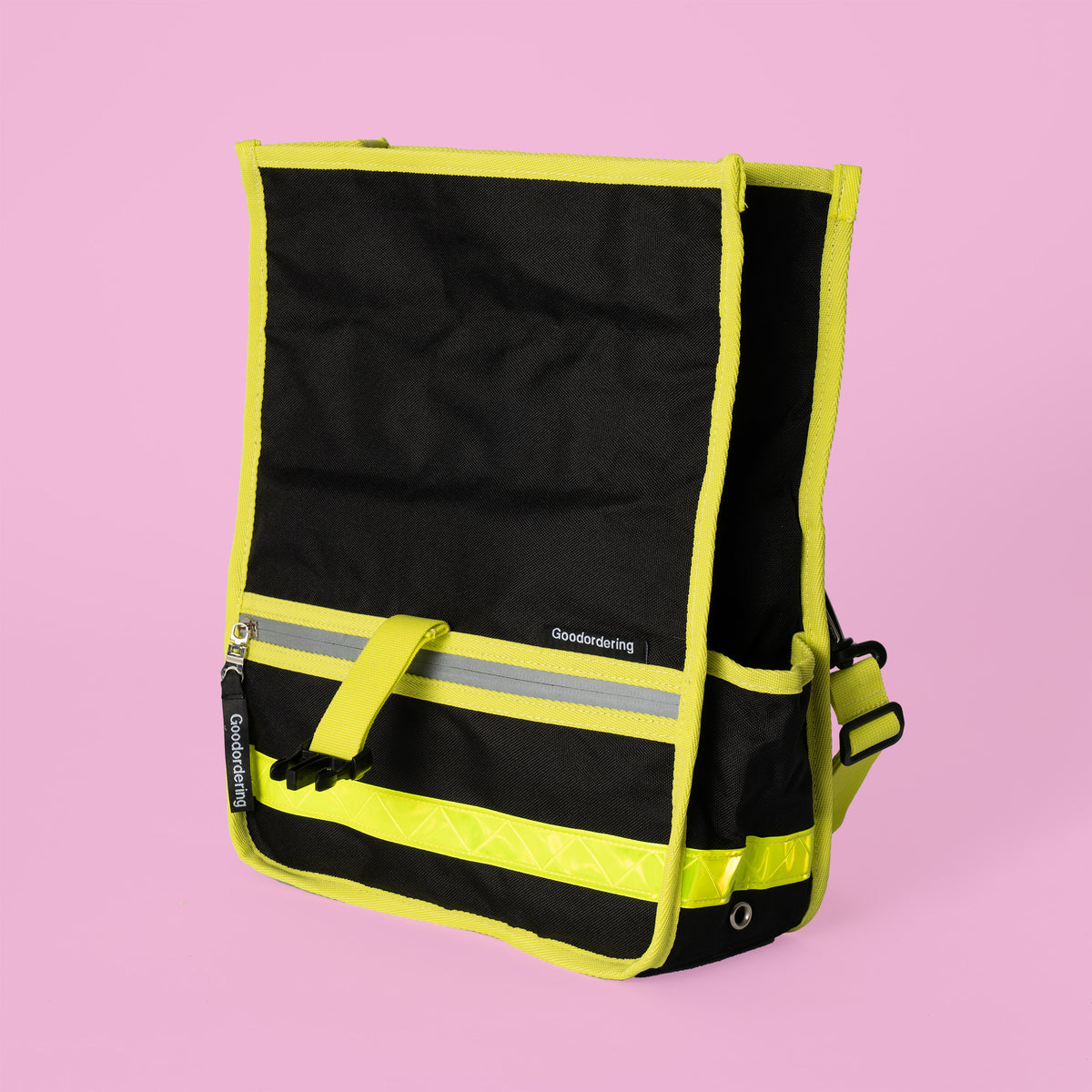Goodordering black shoulder bag with neon yellow edging showing large side pockets 