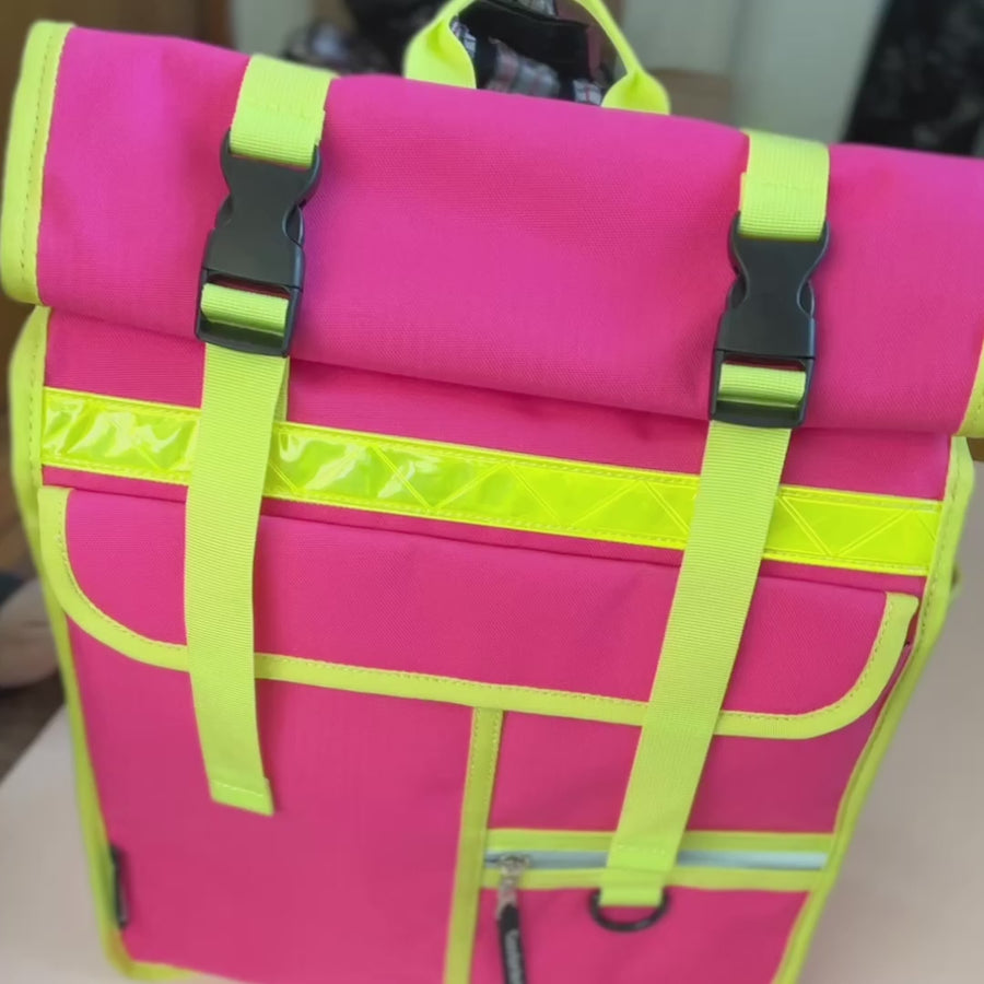 Neon pink rolltop backpack pannier bike bag